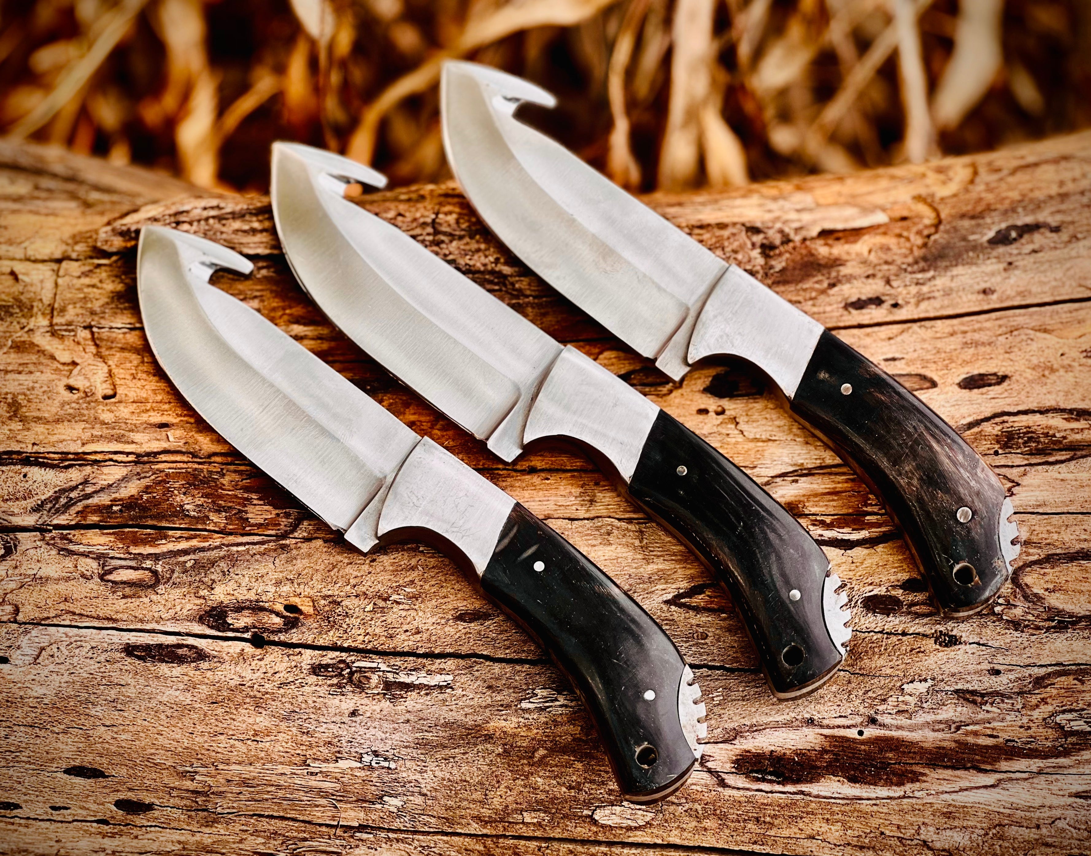 3-piece gut hook skinning knife set with black horn handles