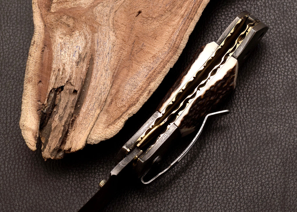 Stag Ridge Damascus folding knife with stag antler handle
