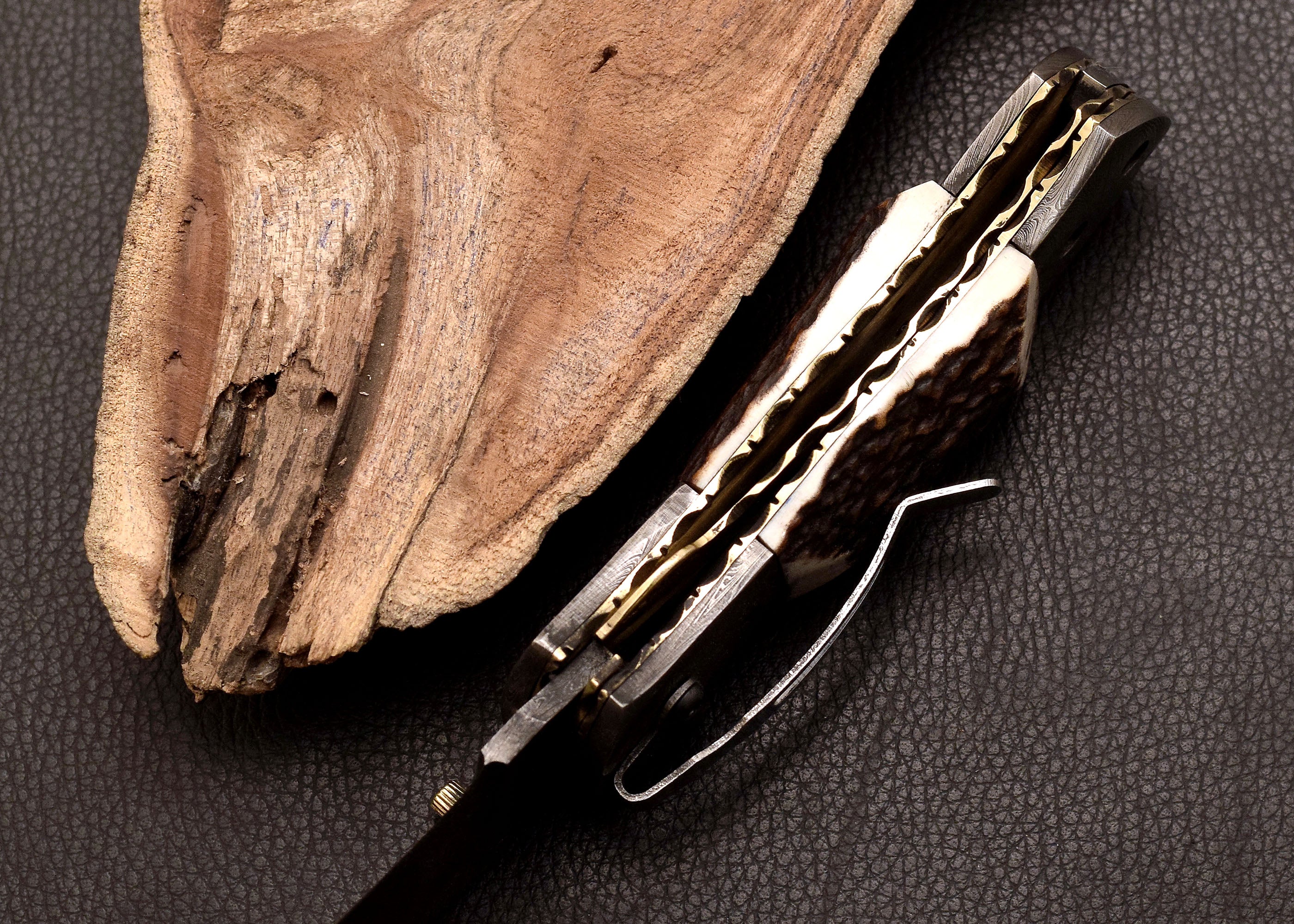 Stag Ridge Damascus folding knife with stag antler handle