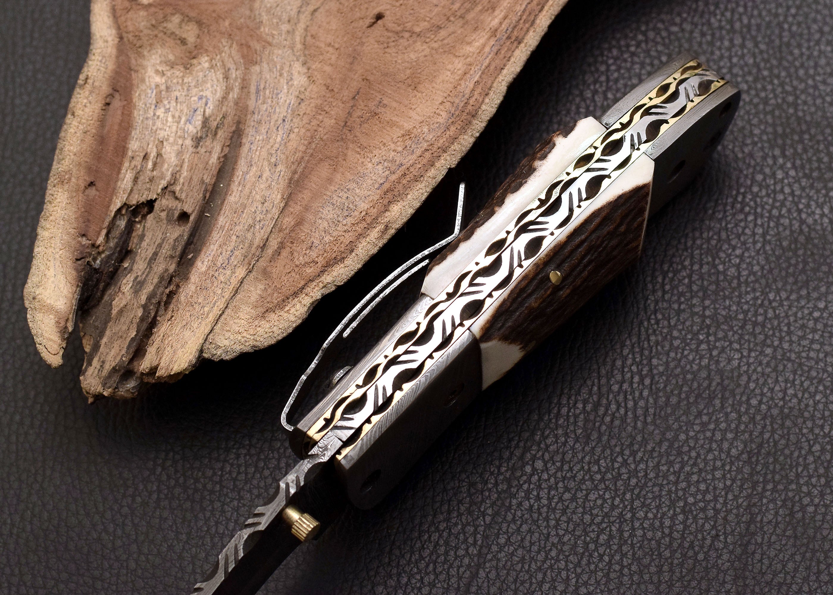 Stag Ridge Damascus folding knife with stag antler handle