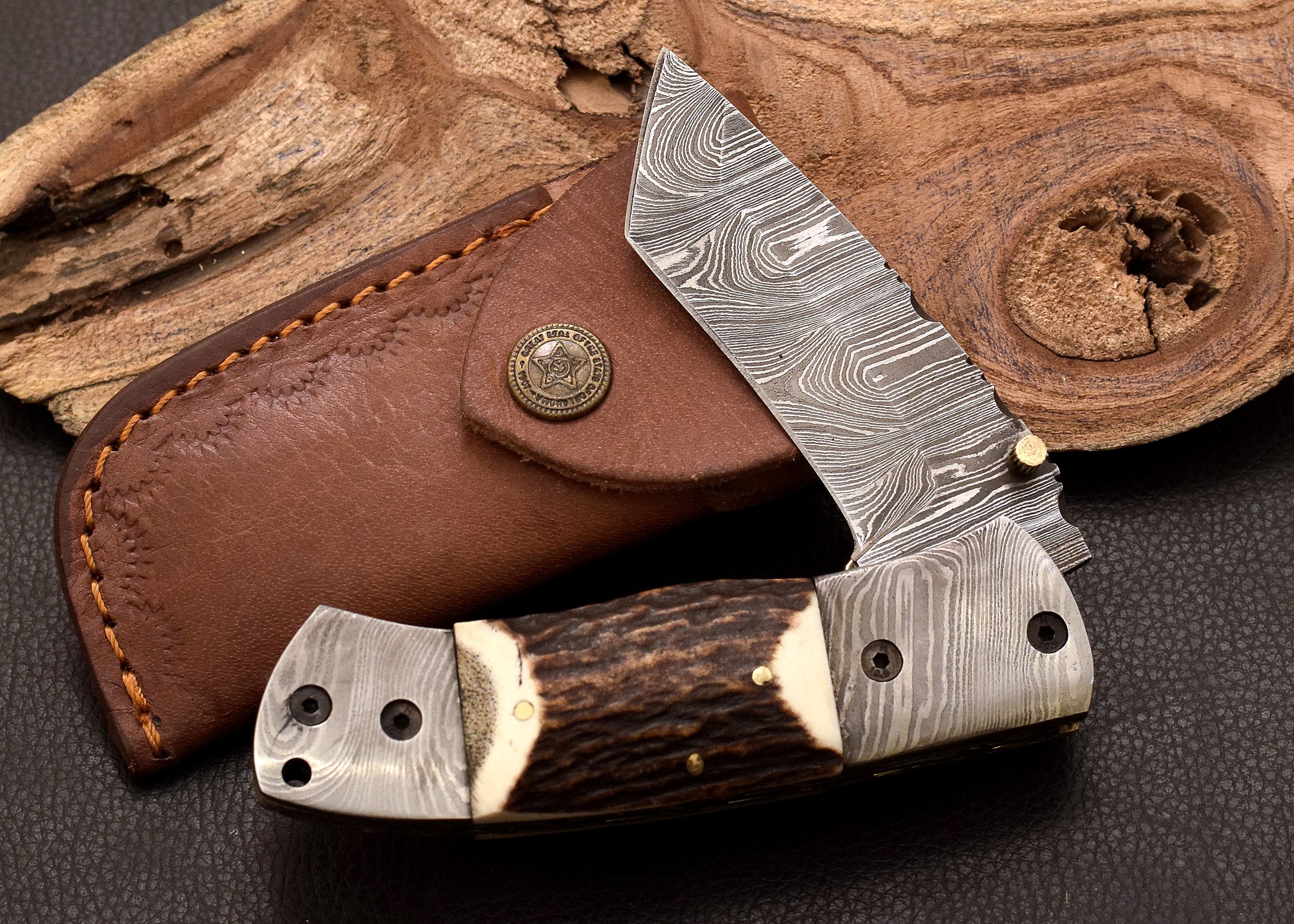 Stag Ridge Damascus folding knife with stag antler handle