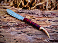 Forged hunting knife with stag antler pommel and cord-wrapped grip