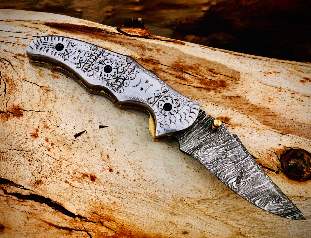 Duskrunner Damascus folding knife with engraved scroll bolsters