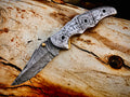 Duskrunner Damascus folding knife with engraved scroll bolsters