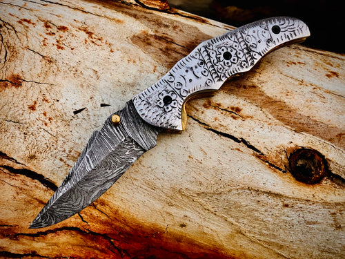 Duskrunner Damascus folding knife with engraved scroll bolsters