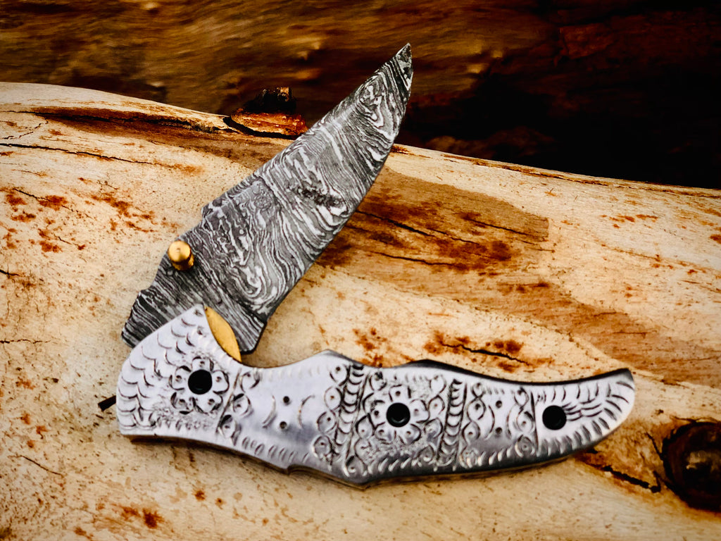 Duskrunner Damascus folding knife with engraved scroll bolsters