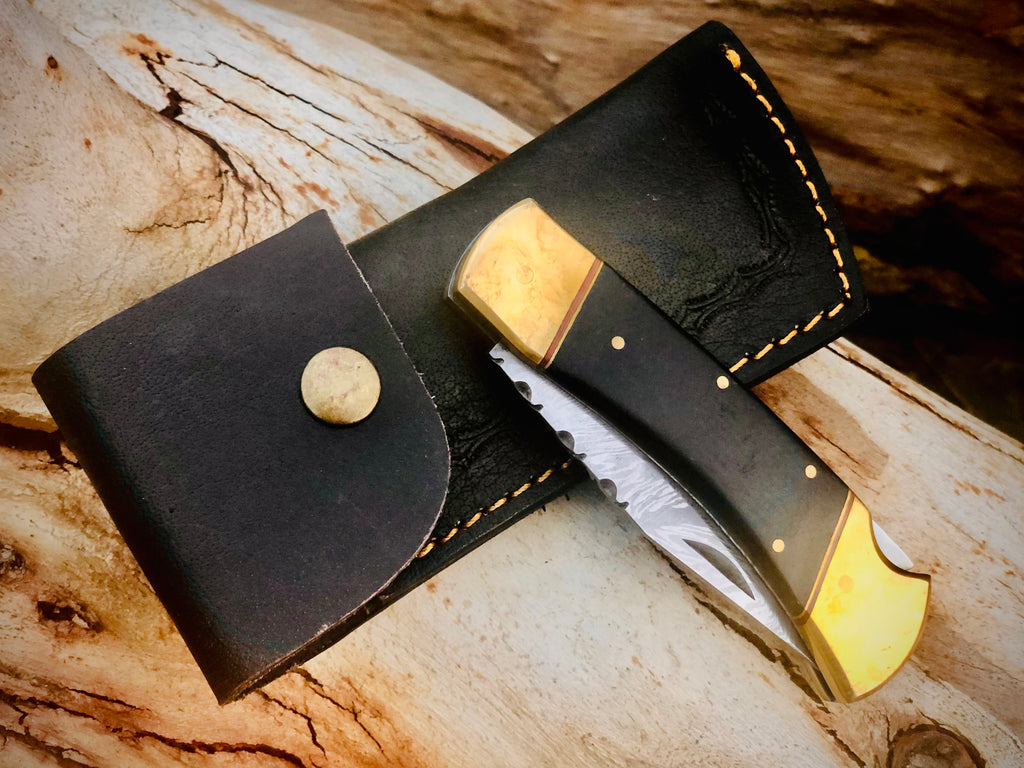 Ironvale lockback folding knife with ebony handle and brass bolsters