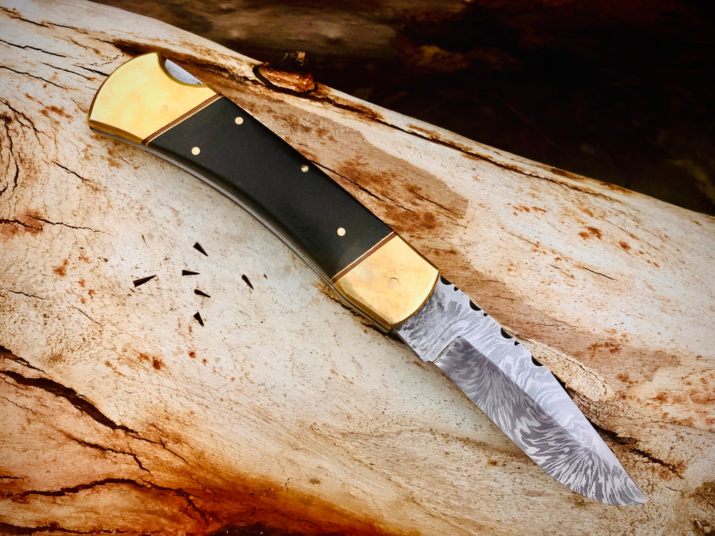 Ironvale lockback folding knife with ebony handle and brass bolsters