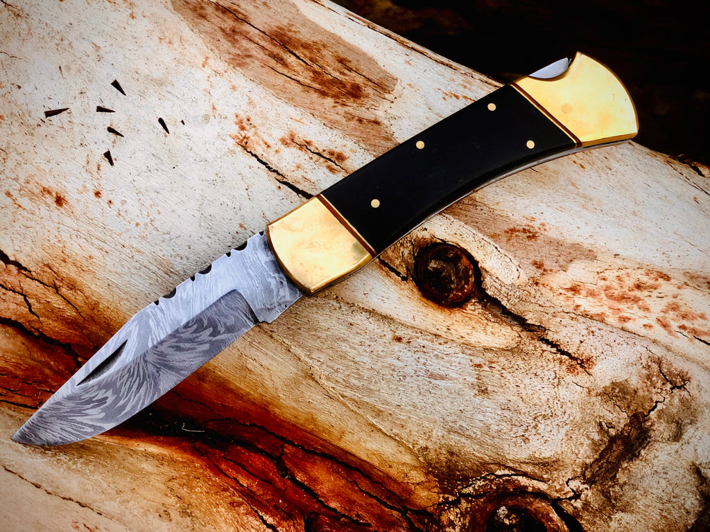 Ironvale lockback folding knife with ebony handle and brass bolsters