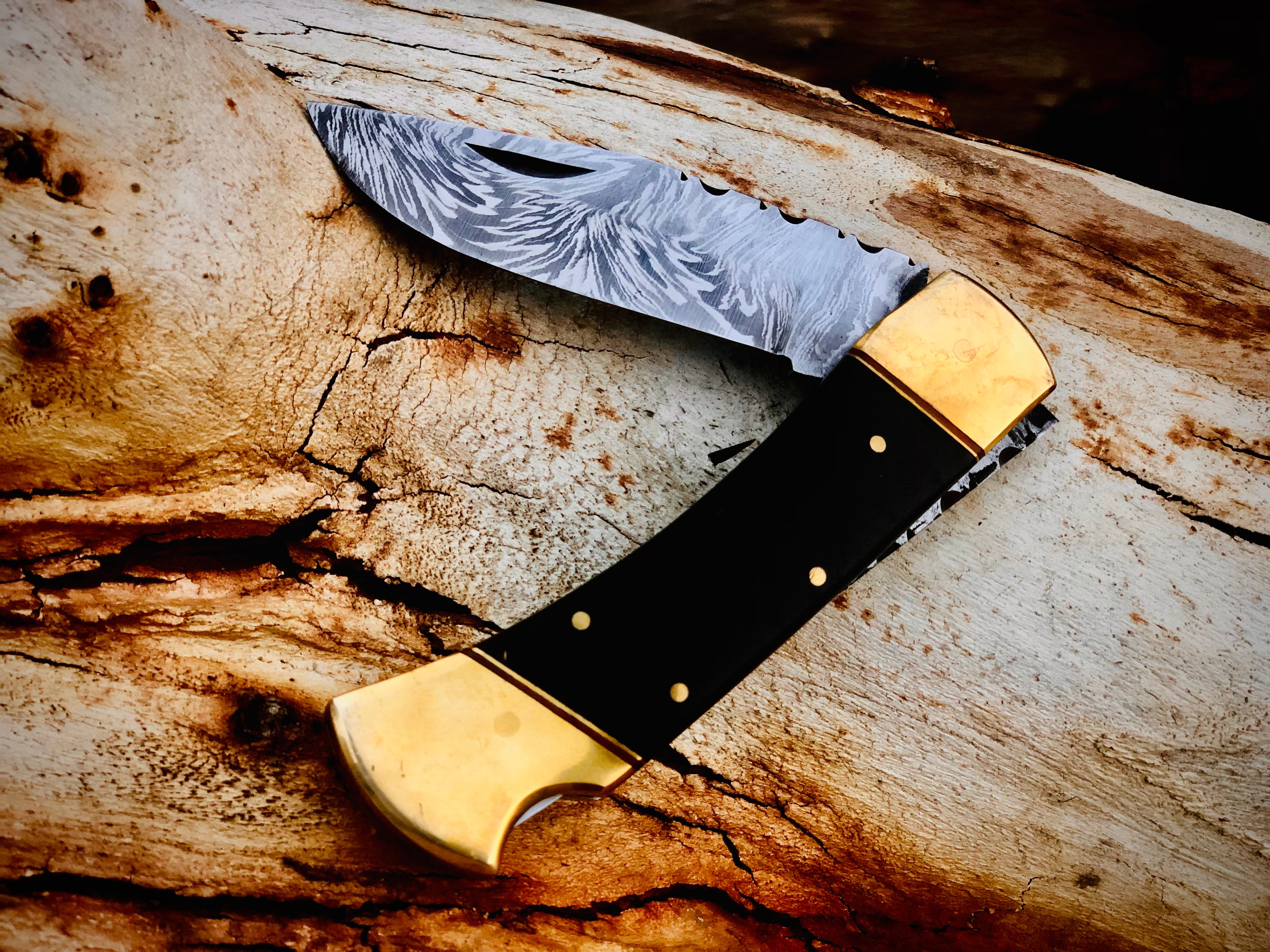 Ironvale lockback folding knife with ebony handle and brass bolsters
