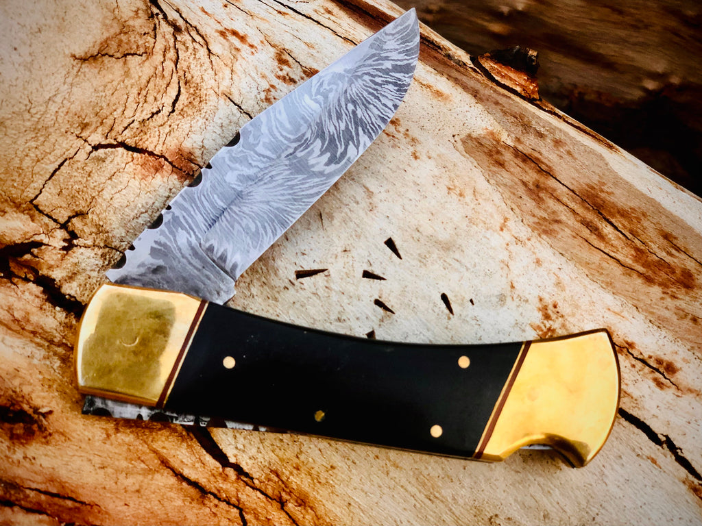 Ironvale lockback folding knife with ebony handle and brass bolsters