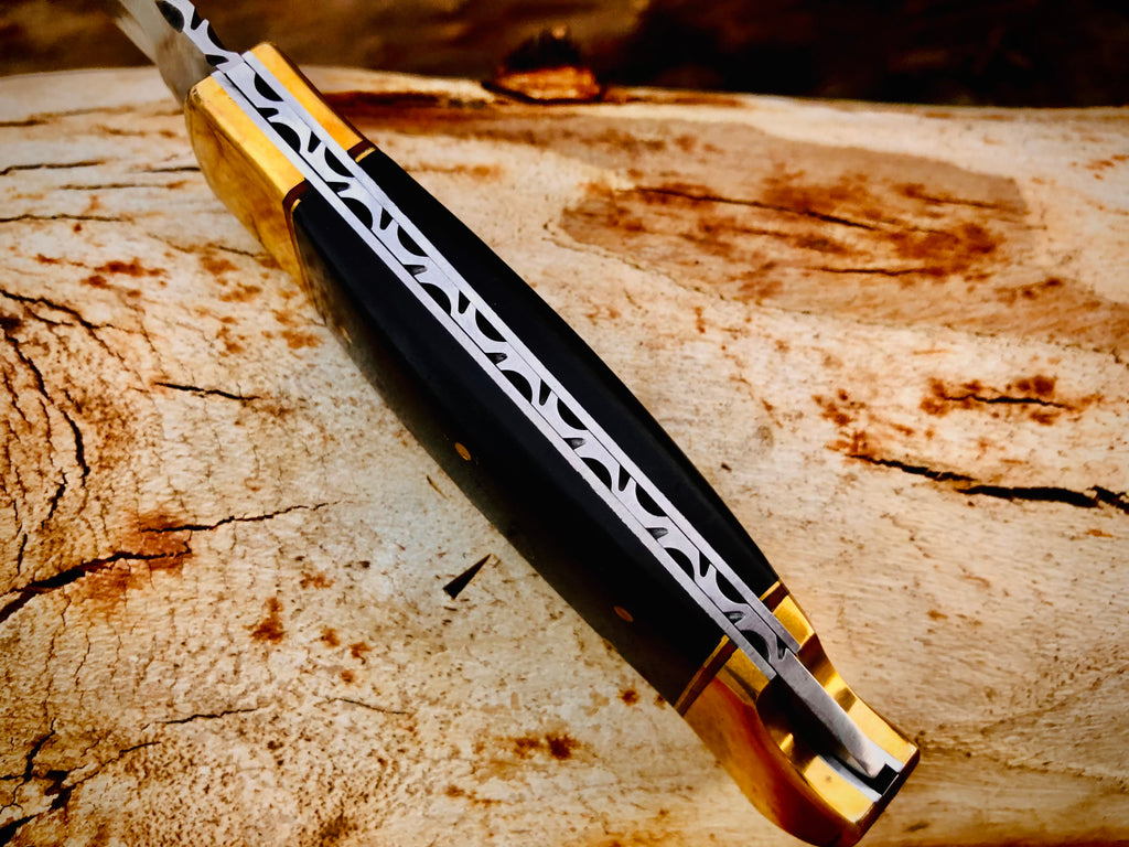 Ironvale lockback folding knife with ebony handle and brass bolsters