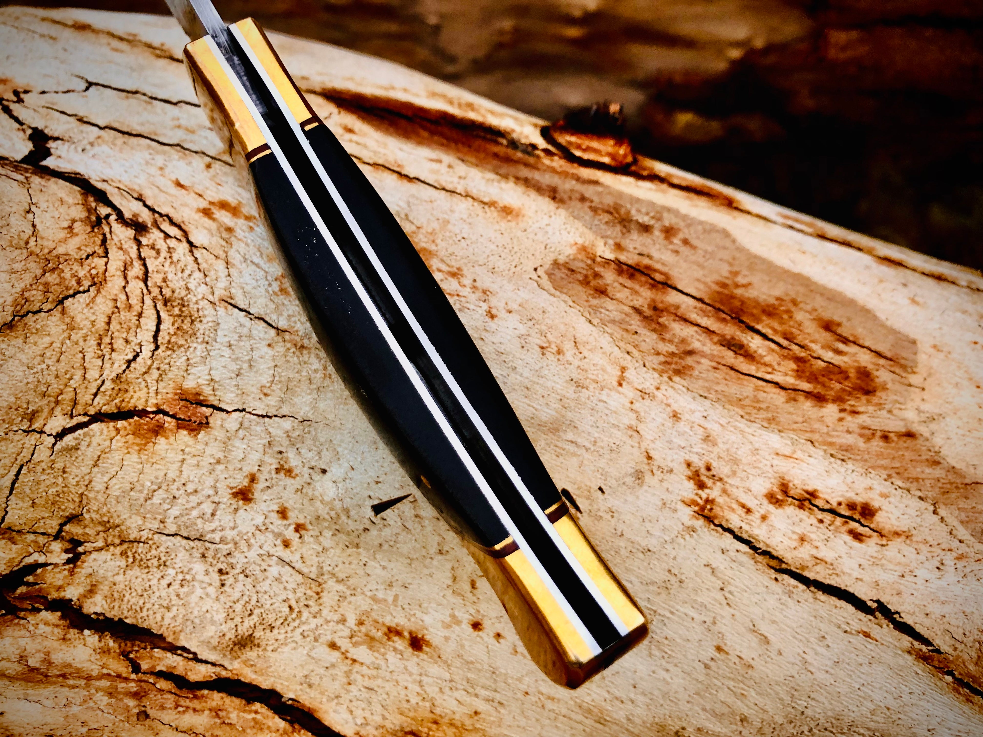 Ironvale lockback folding knife with ebony handle and brass bolsters