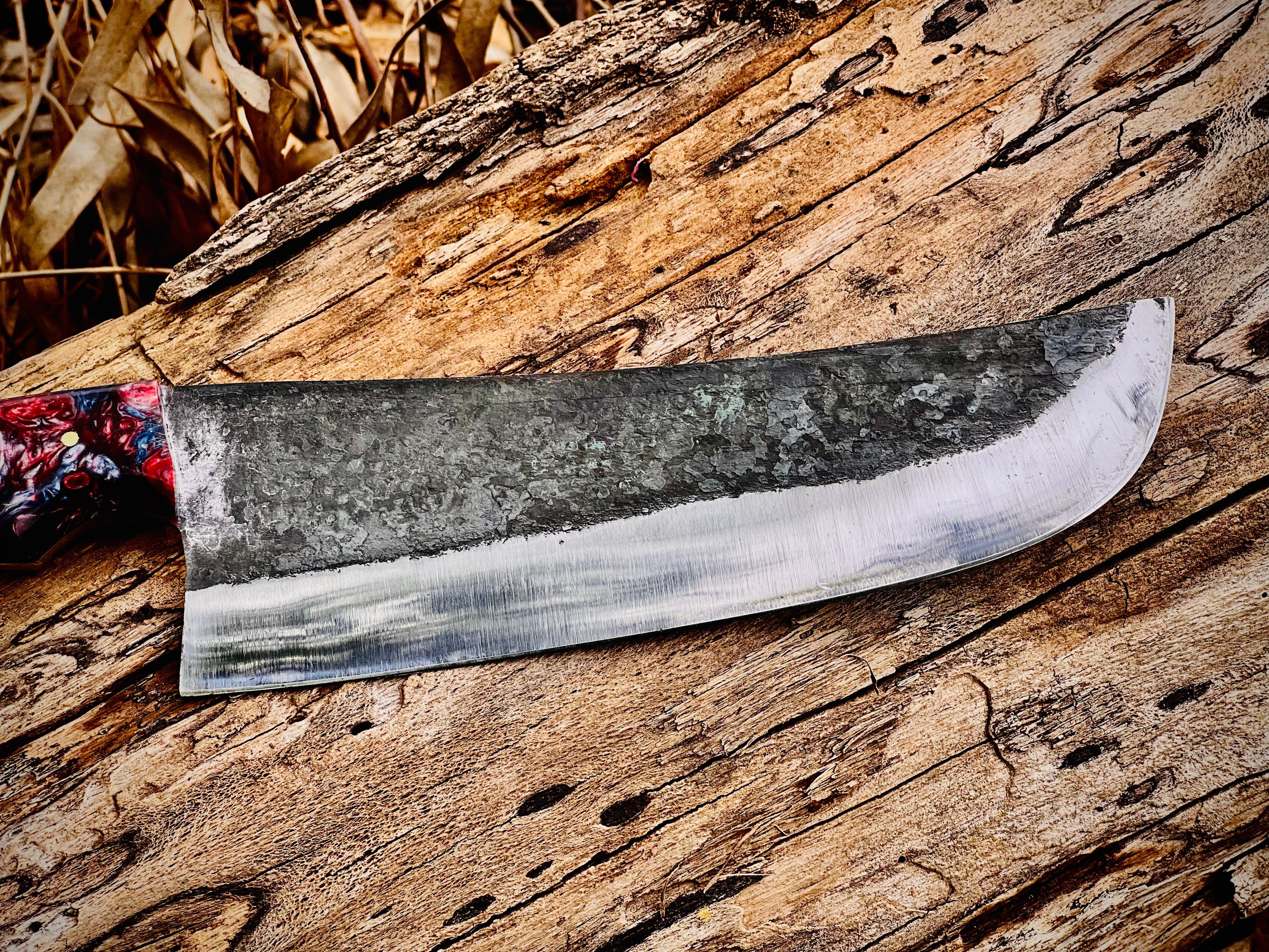 Forged chef knife with galaxy resin handle and hamon line