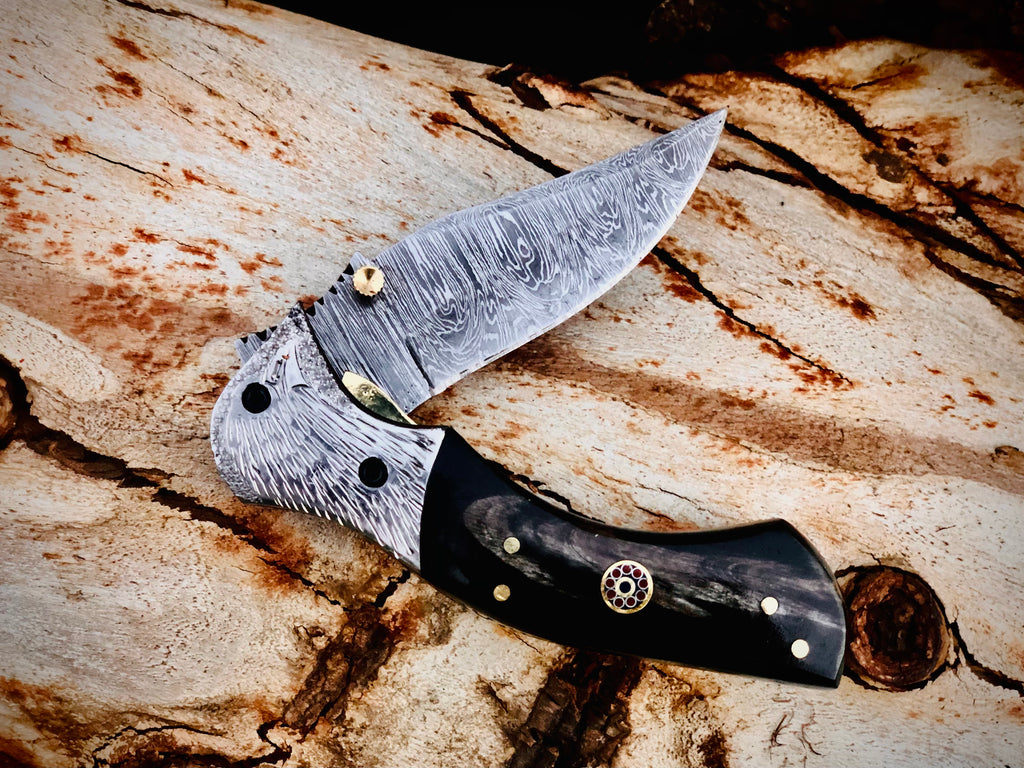Ember Rose Damascus folding knife with gemstone rosette inlay
