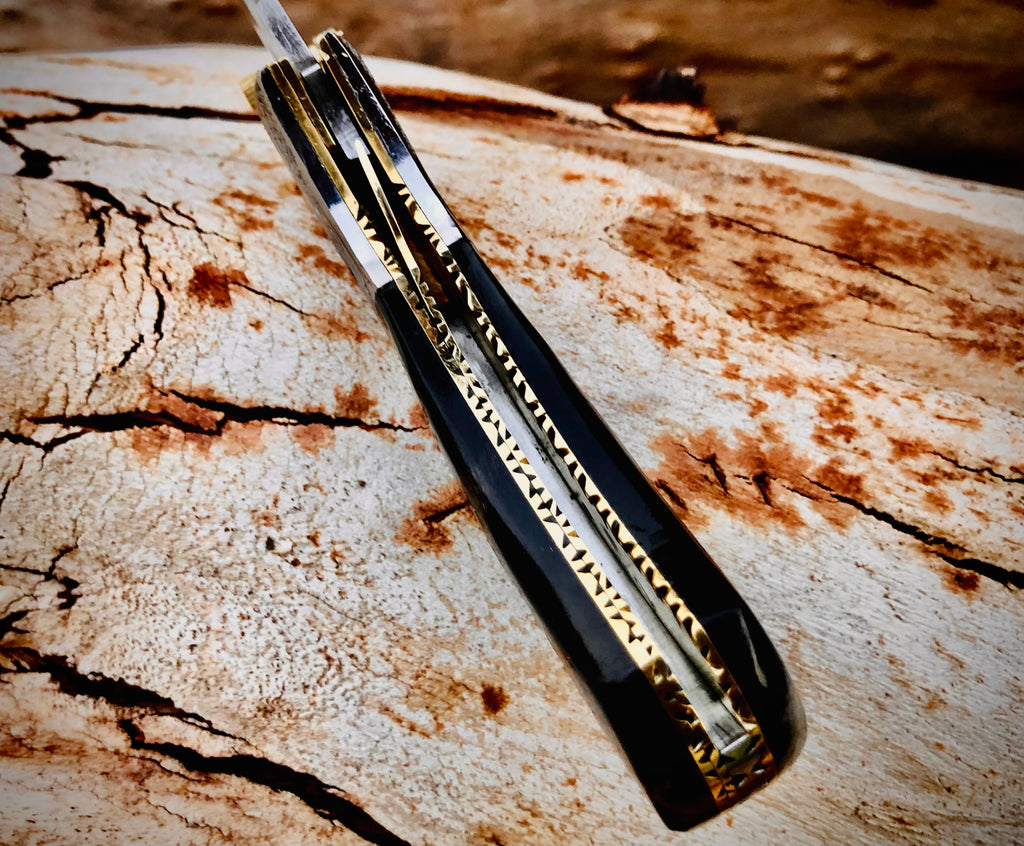 Ember Rose Damascus folding knife with gemstone rosette inlay