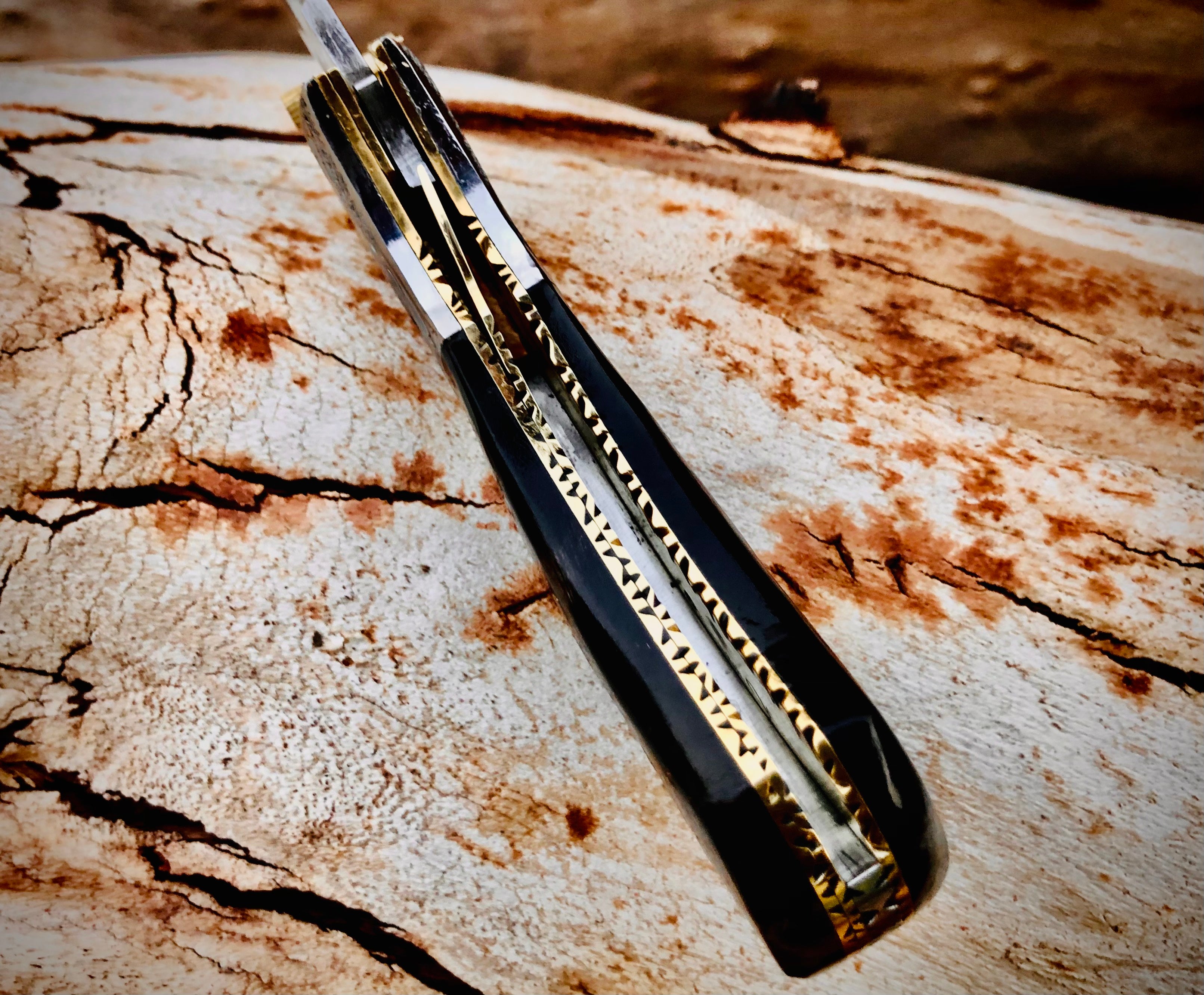 Ember Rose Damascus folding knife with gemstone rosette inlay