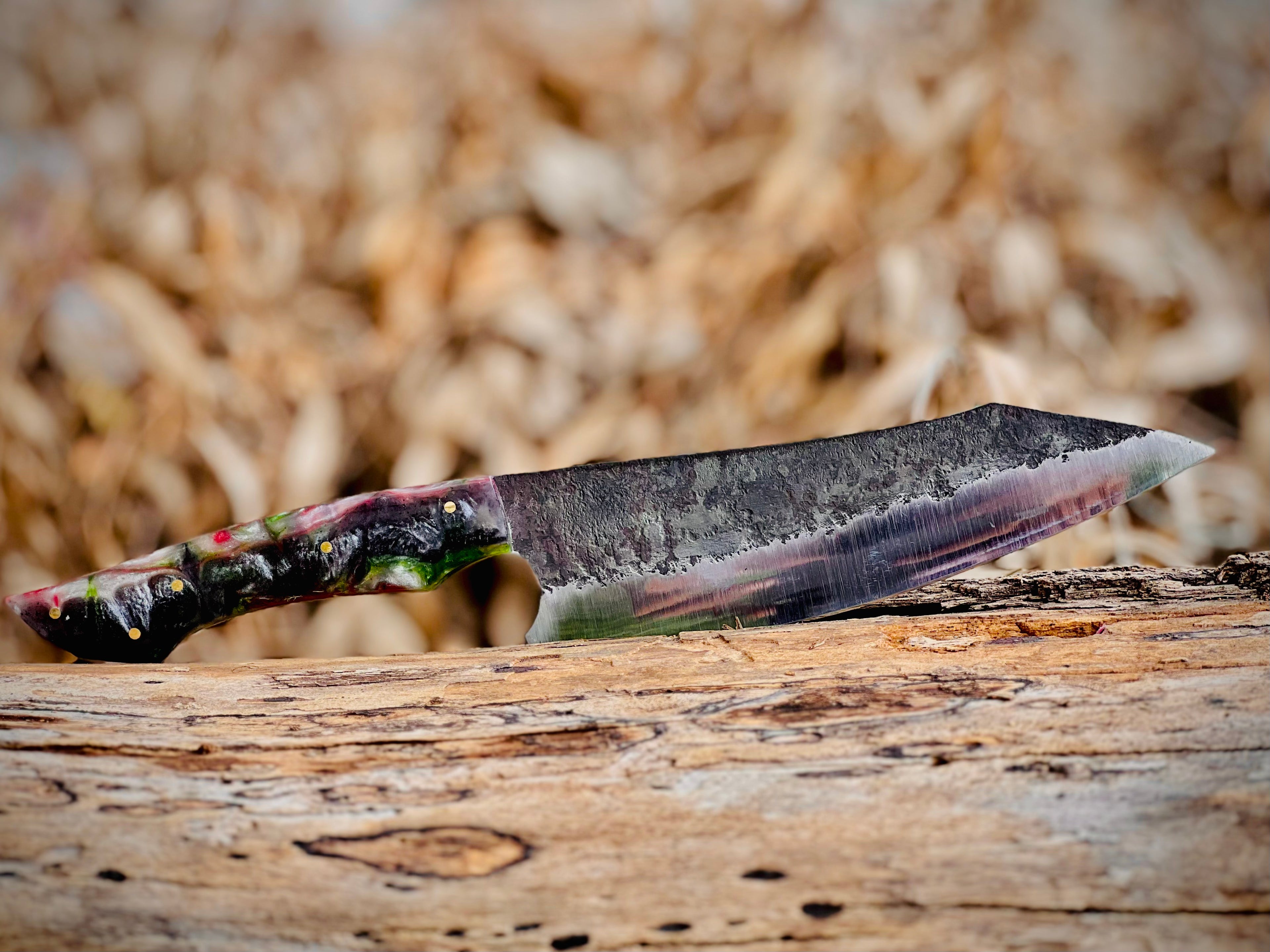 Forged chef knife with red and green resin handle