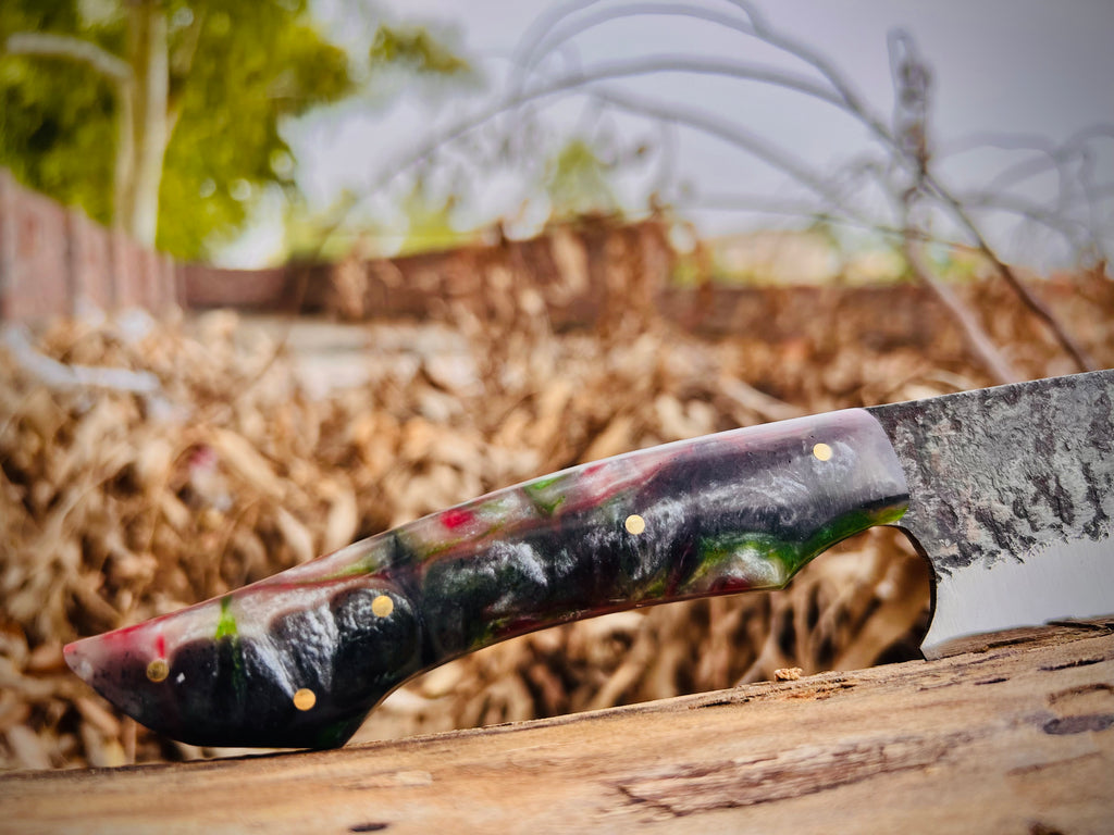 Forged chef knife with red and green resin handle