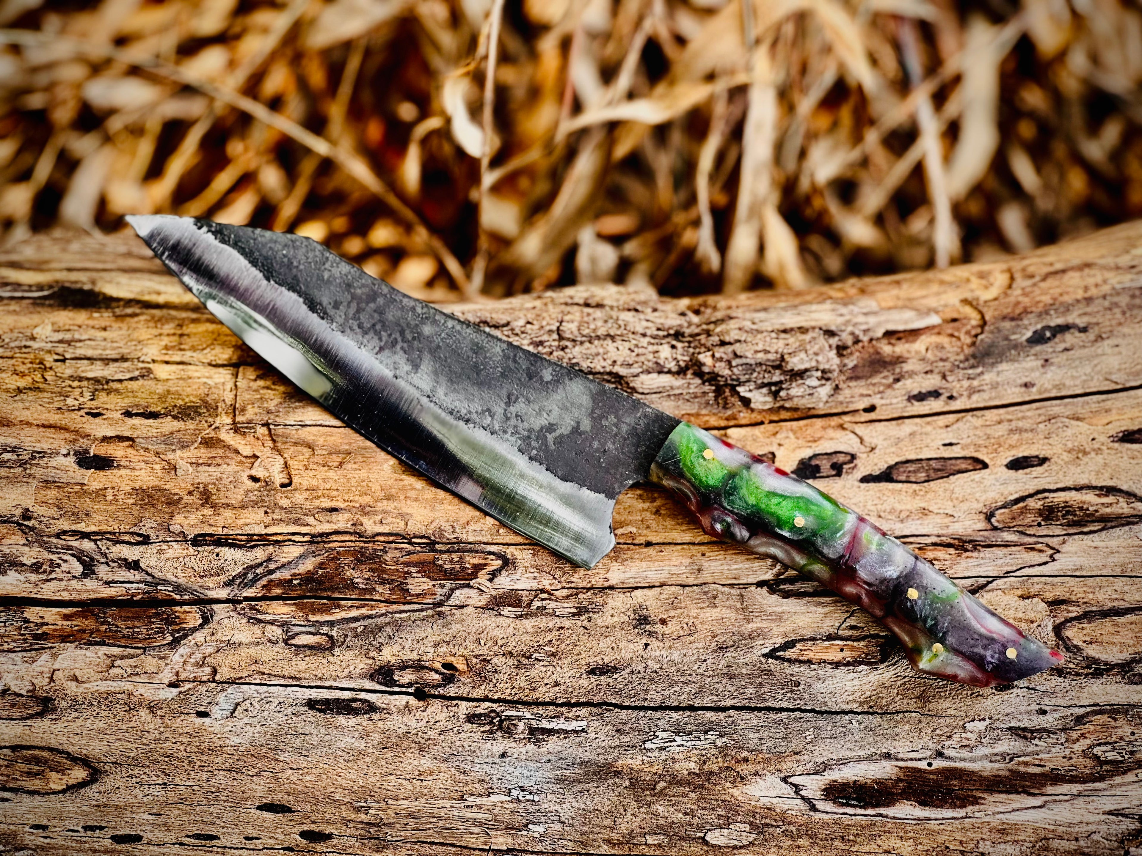 Forged chef knife with red and green resin handle
