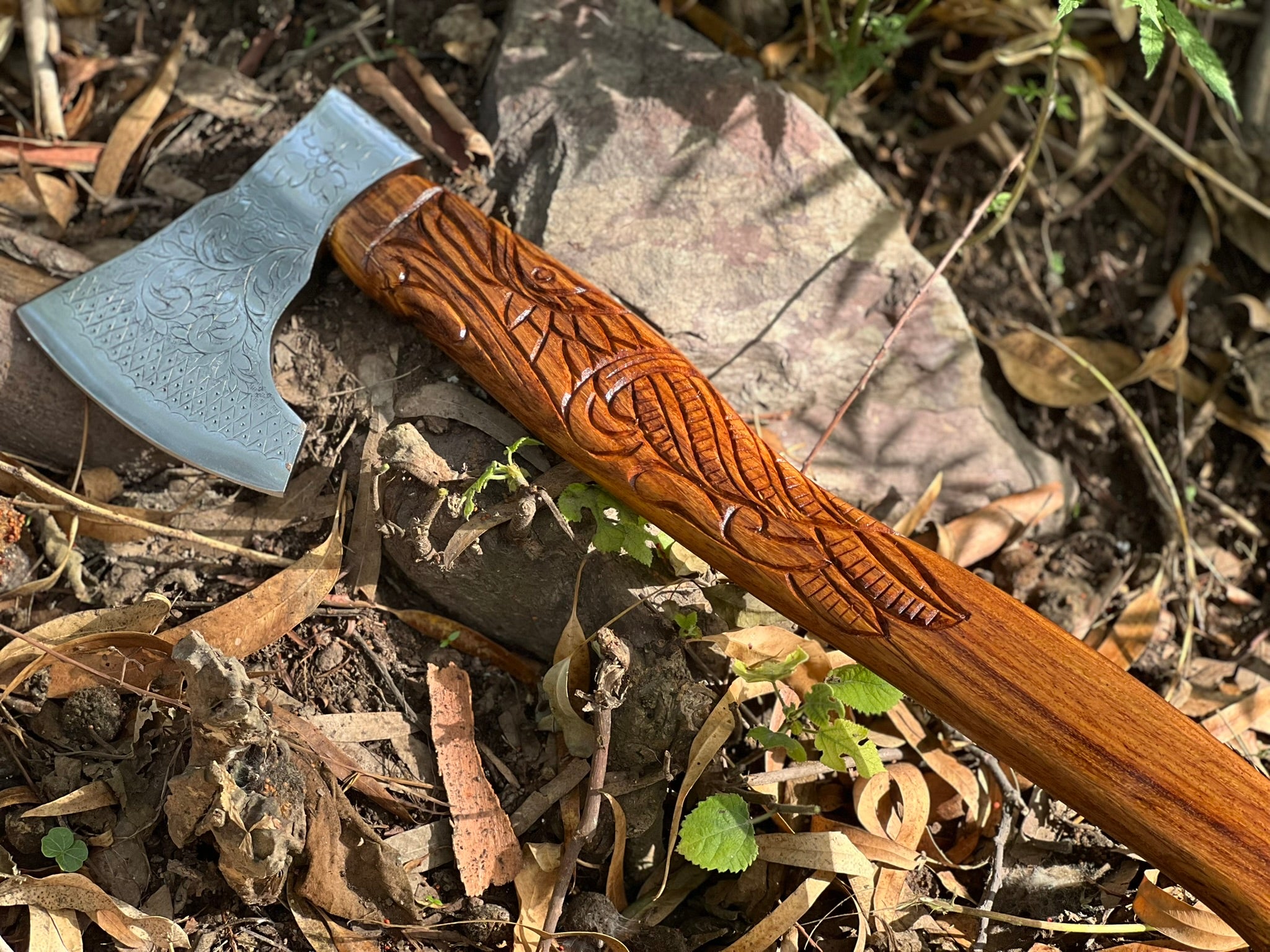 Ravenwood engraved display axe with carved raven-motif haft