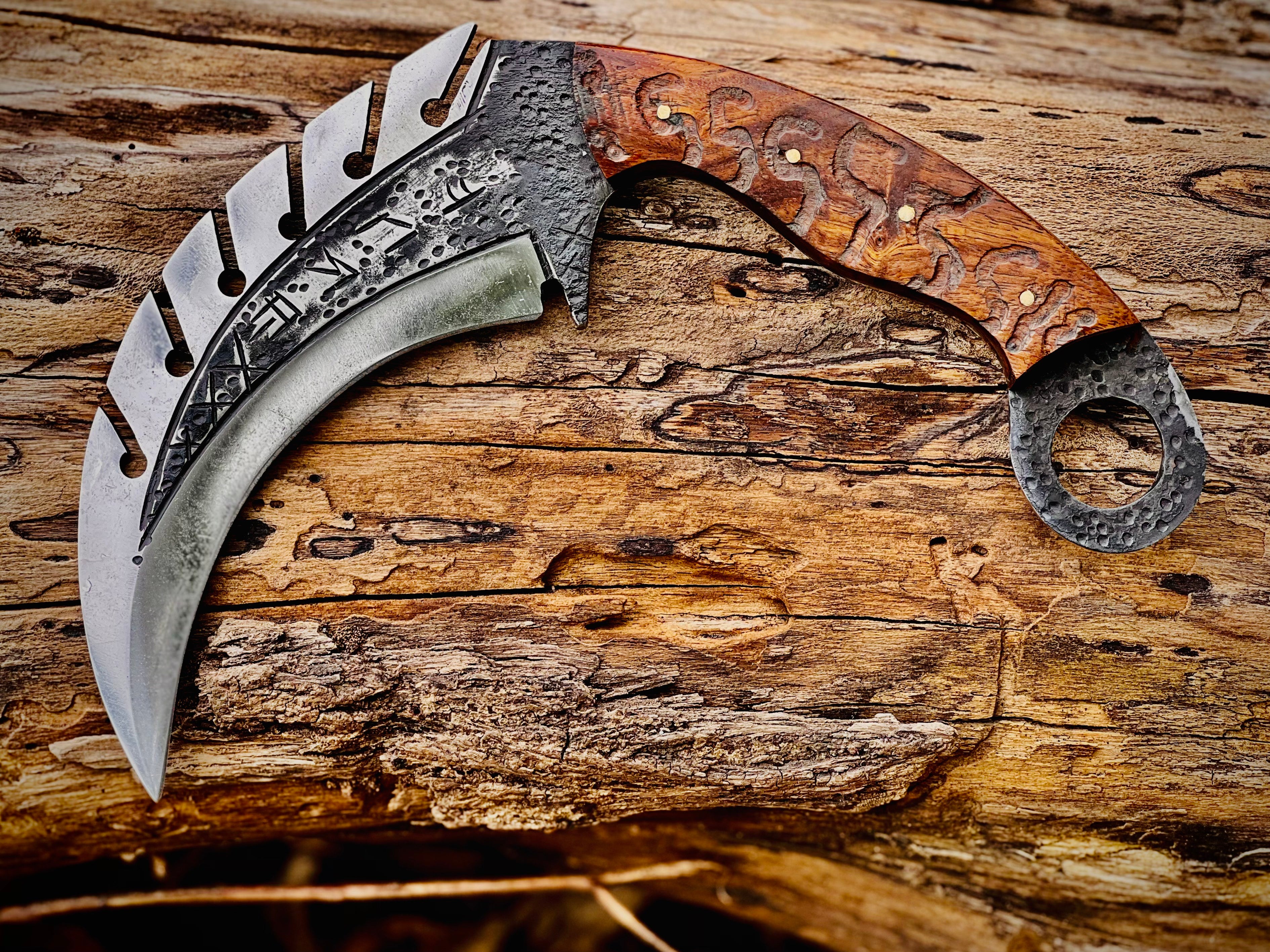Forged karambit utility knife with wood handle and saw-tooth spine