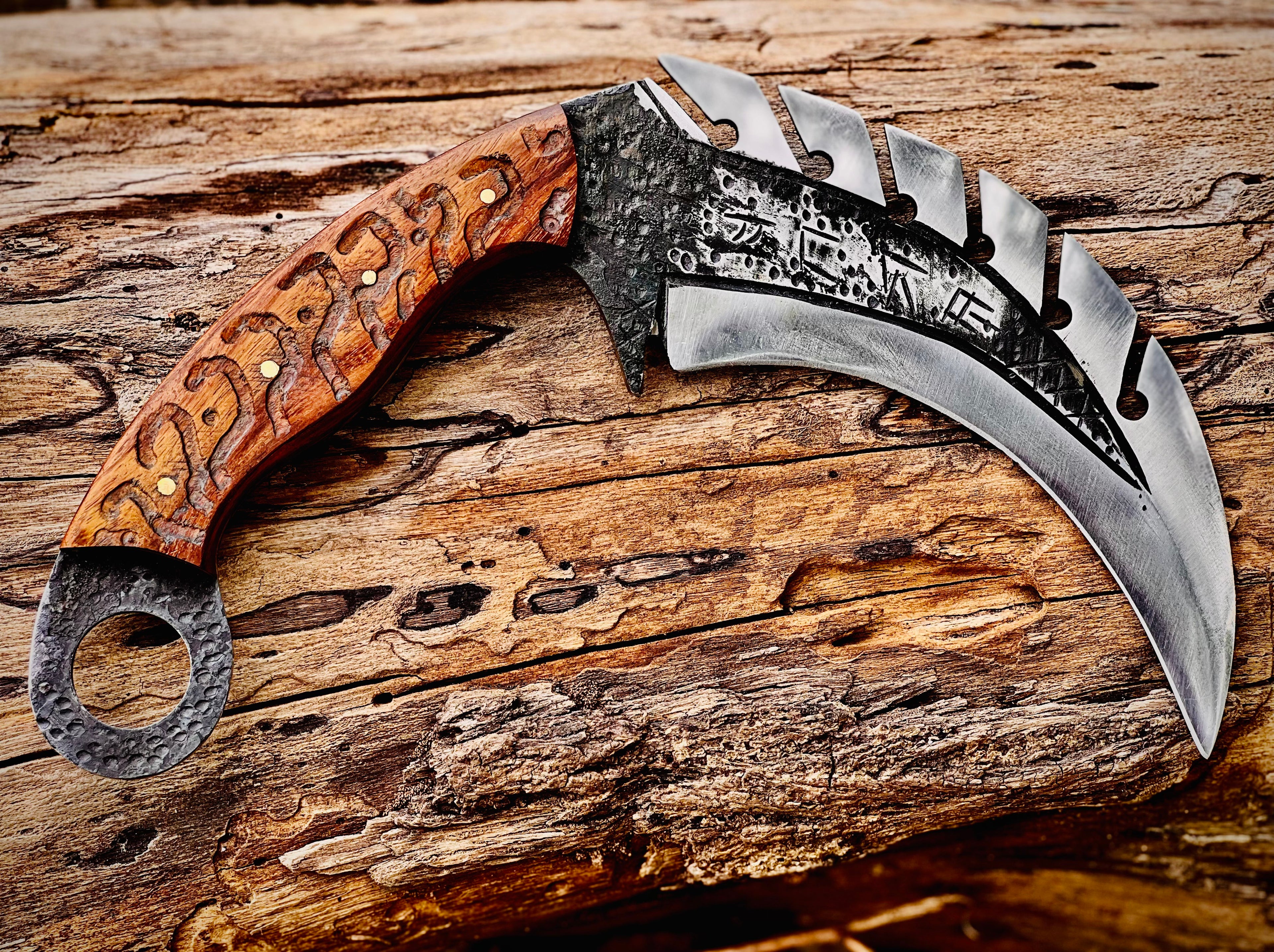 Forged karambit utility knife with wood handle and saw-tooth spine