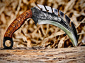 Forged karambit utility knife with wood handle and saw-tooth spine