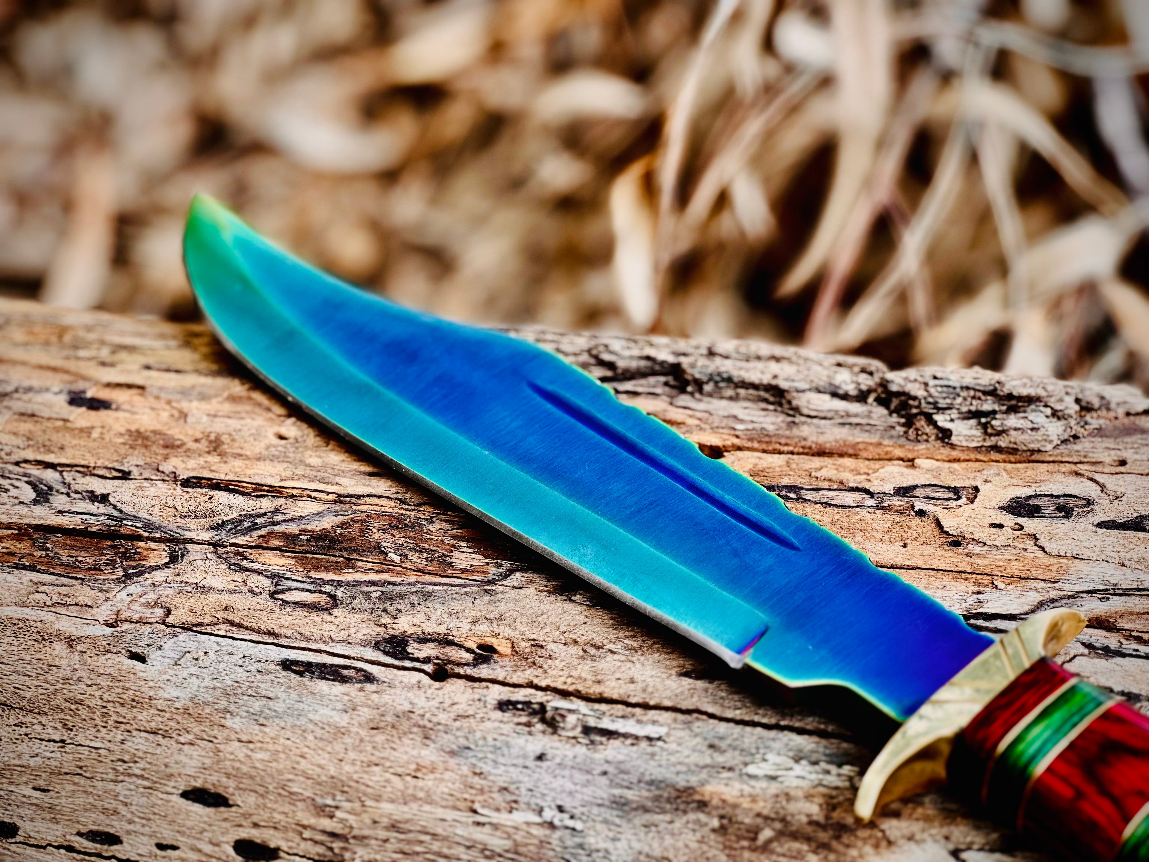 Hand-forged bowie knife with cord-wrapped handle and brass guard
