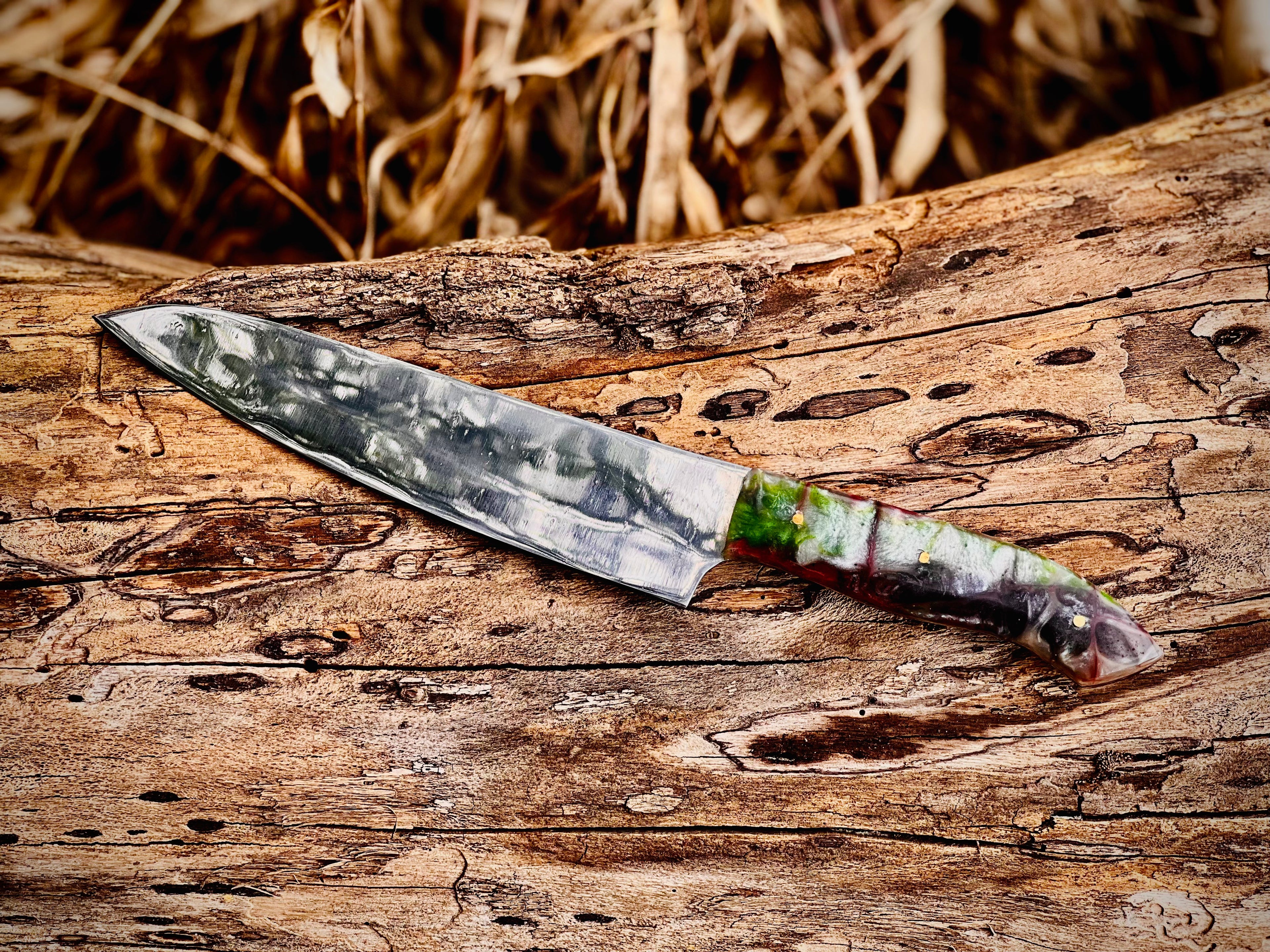 Forged chef knife with emerald swirl resin handle