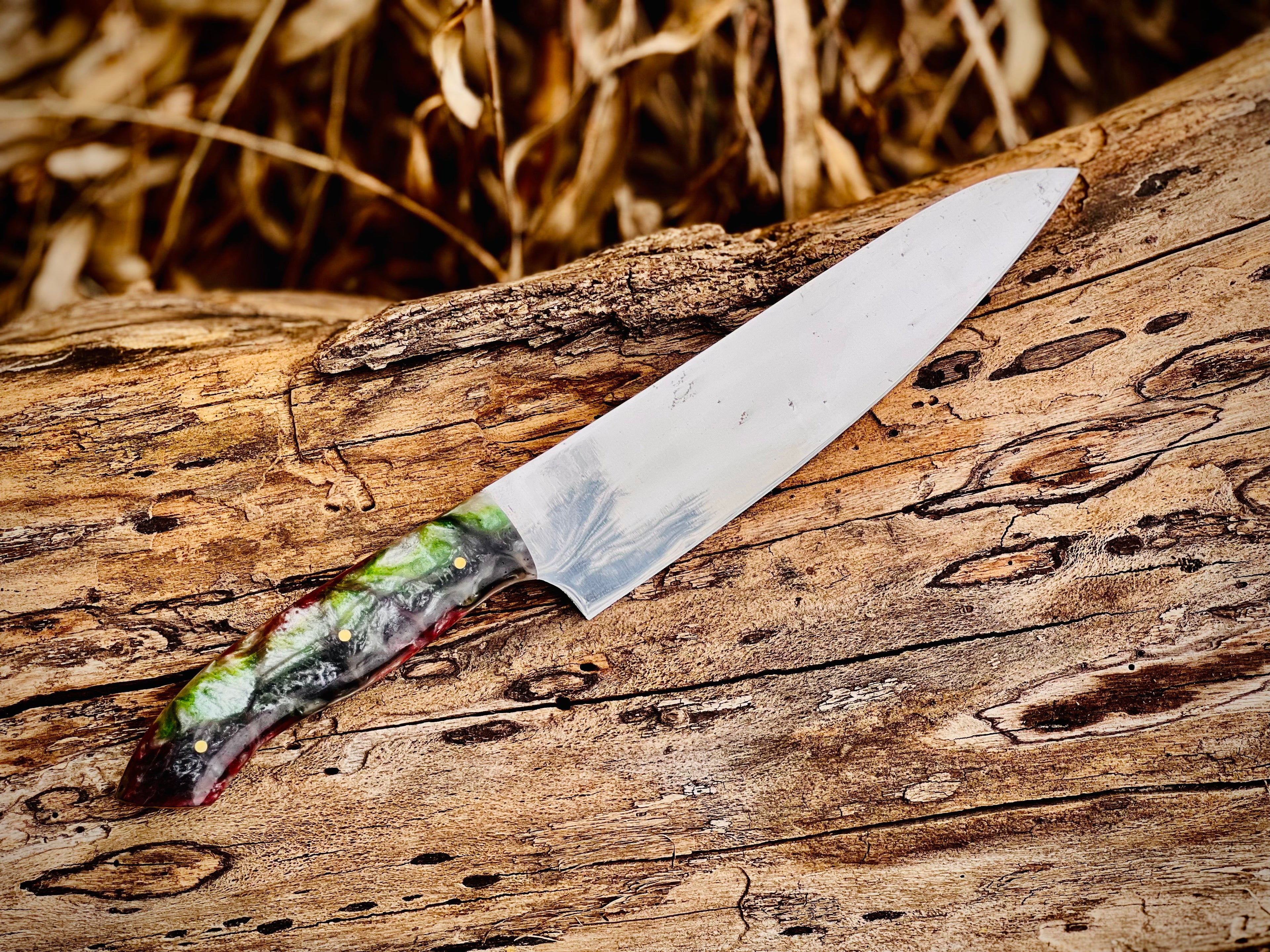 Forged chef knife with emerald swirl resin handle