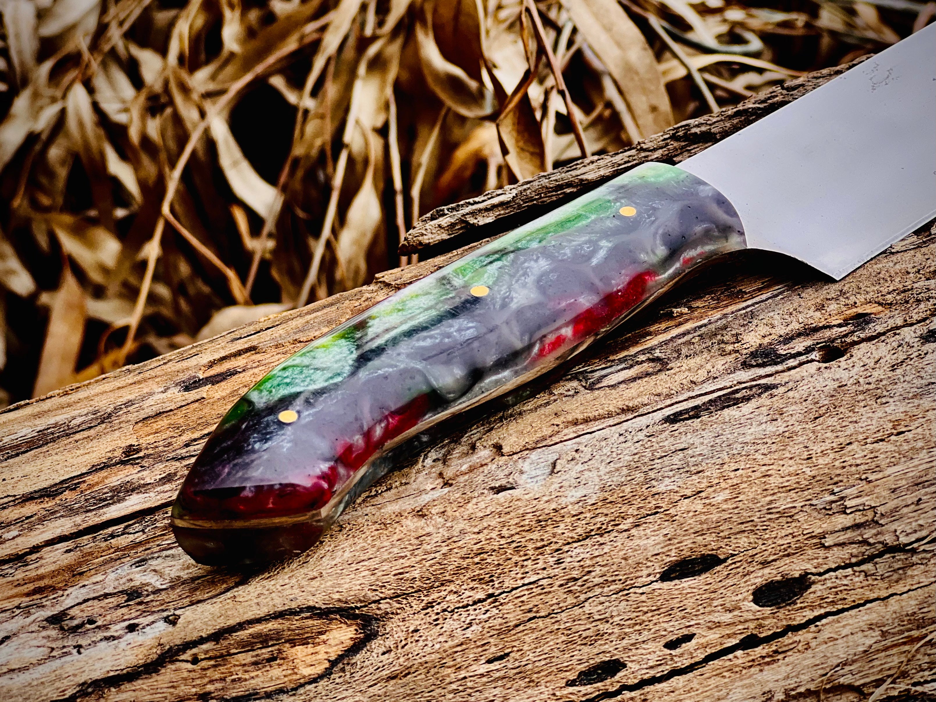 Forged chef knife with emerald swirl resin handle