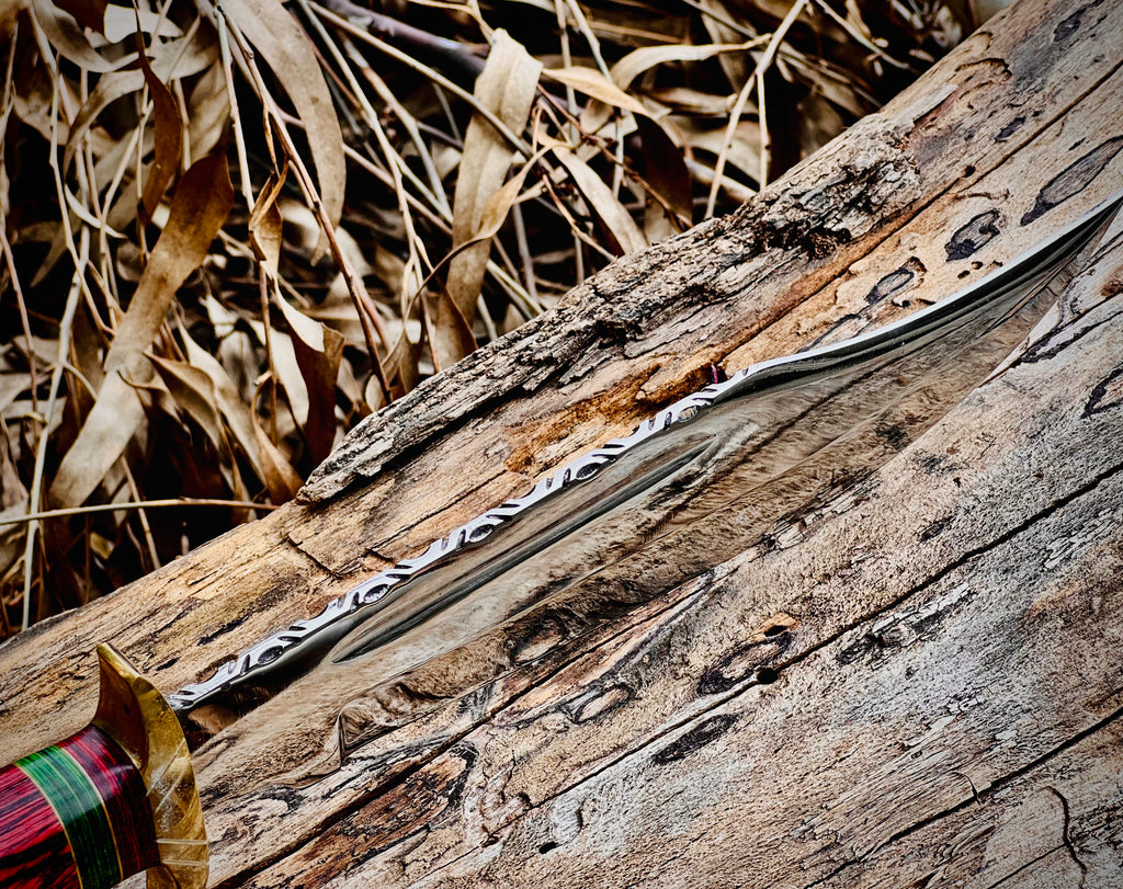 Hand-forged bowie knife with cord-wrapped handle and brass guard