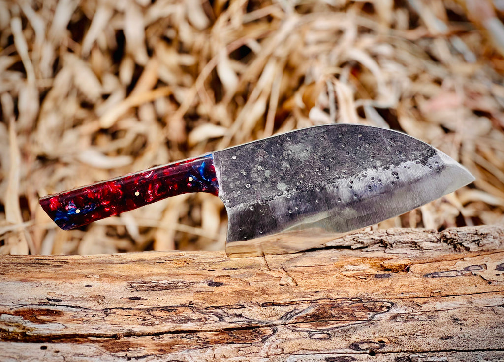 Hand-forged chef's cleaver with galaxy resin handle and hamon line