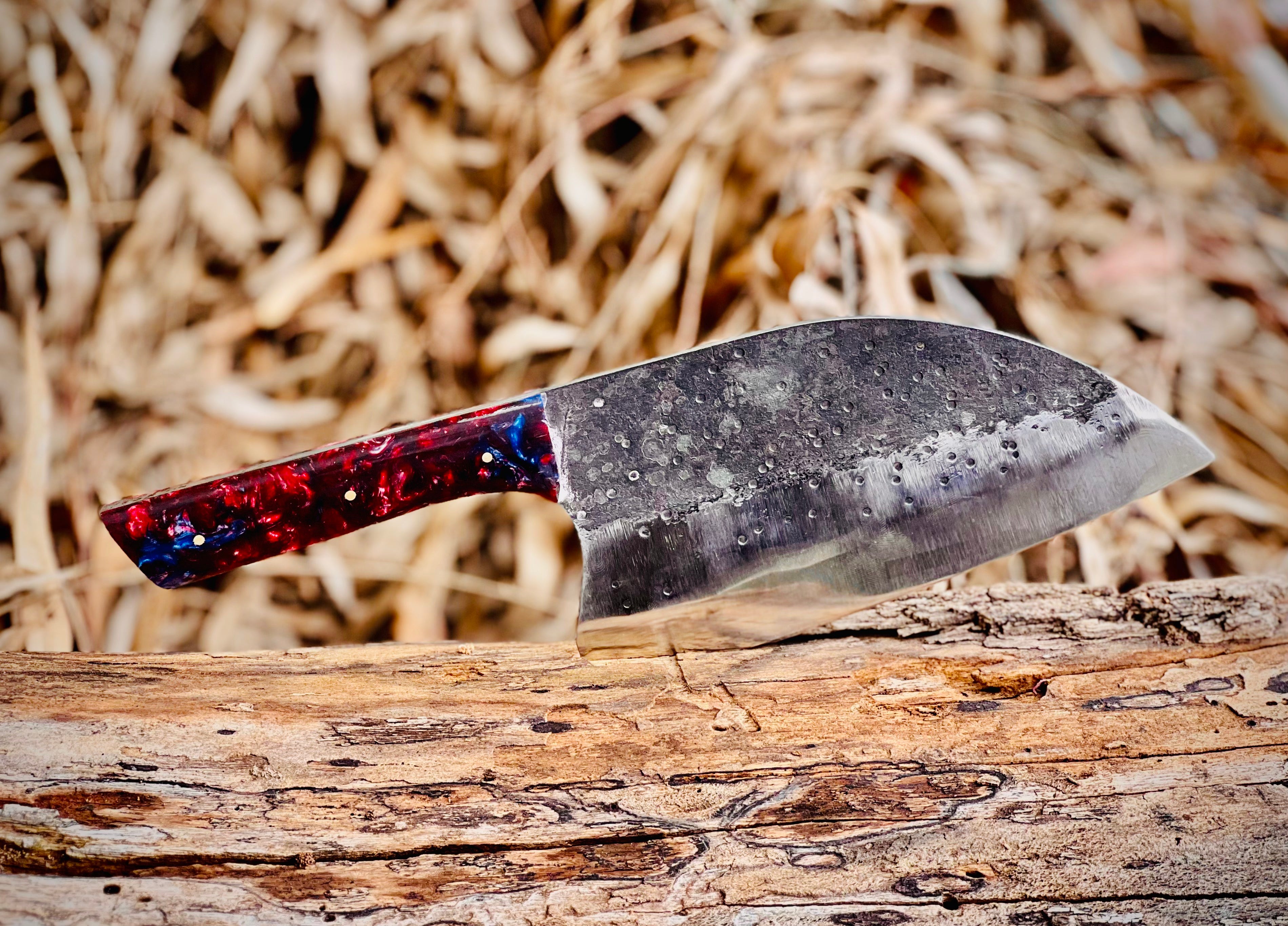 Hand-forged chef's cleaver with galaxy resin handle and hamon line