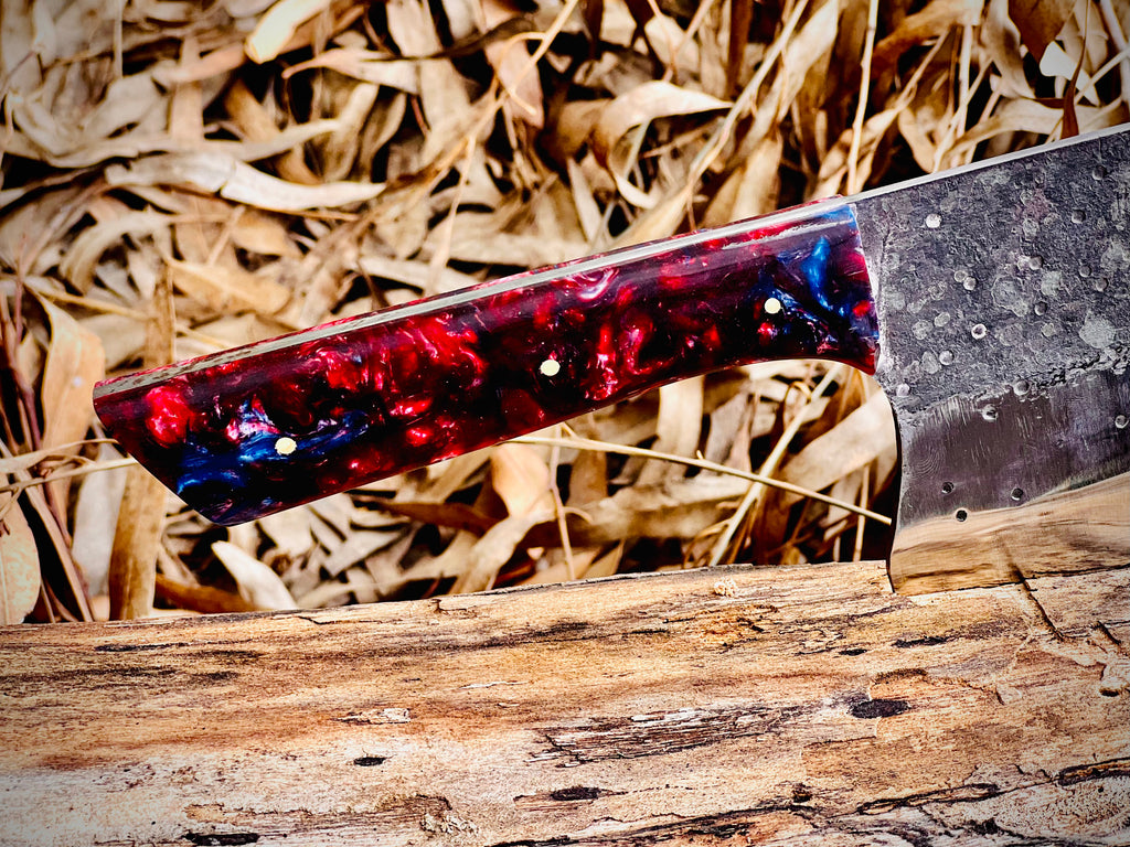 Hand-forged chef's cleaver with galaxy resin handle and hamon line