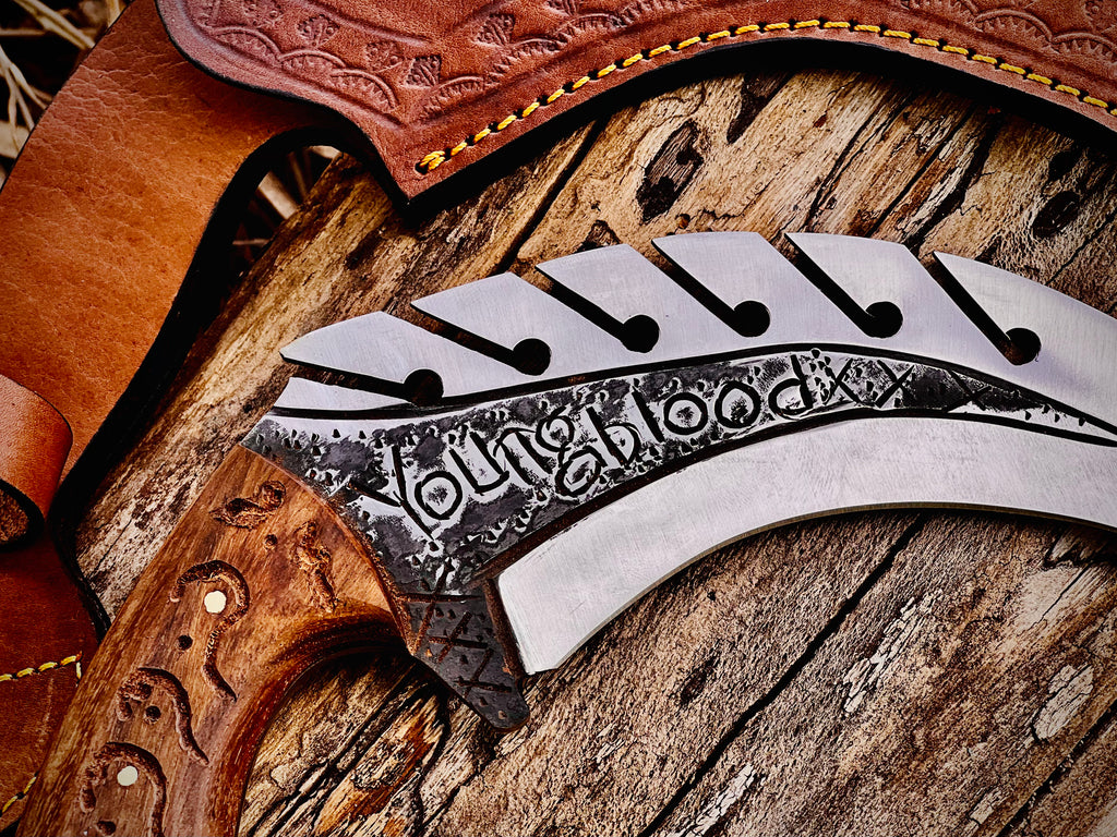 Forged karambit utility knife with wood handle and saw-tooth spine
