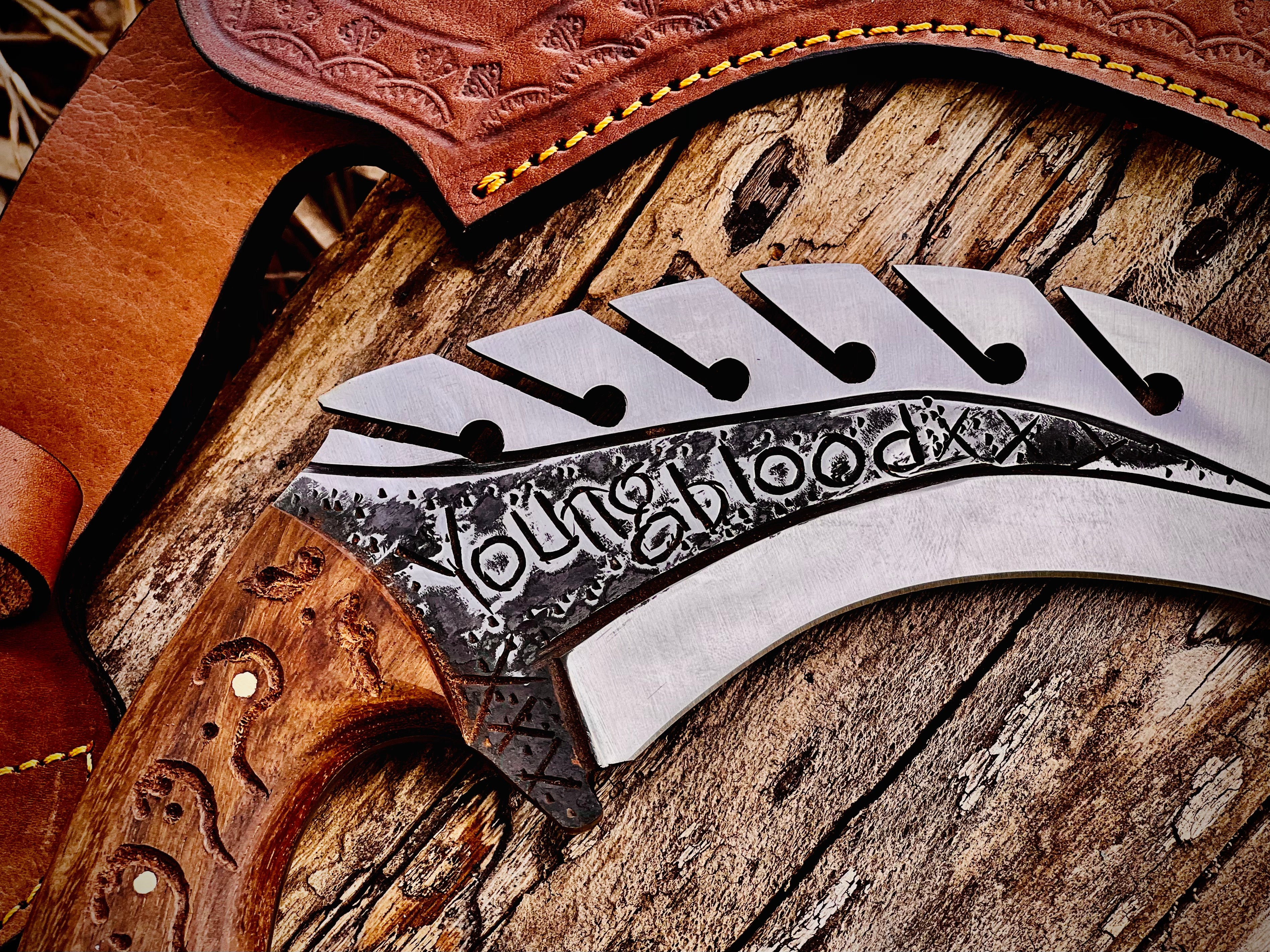 Forged karambit utility knife with wood handle and saw-tooth spine
