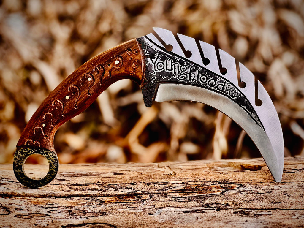 Forged karambit utility knife with wood handle and saw-tooth spine