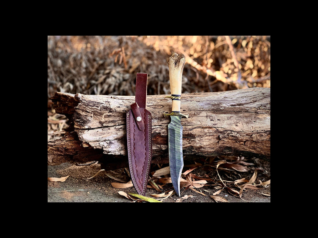 Boneguard Damascus hunting knife with bone handle and brass guard