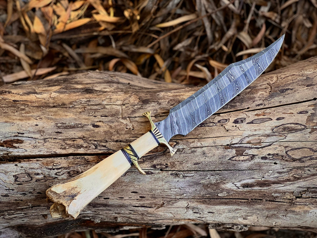 Boneguard Damascus hunting knife with bone handle and brass guard