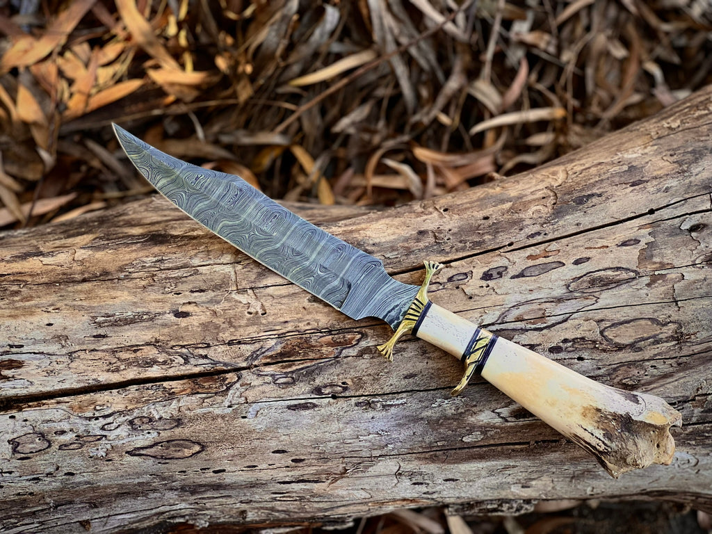 Boneguard Damascus hunting knife with bone handle and brass guard