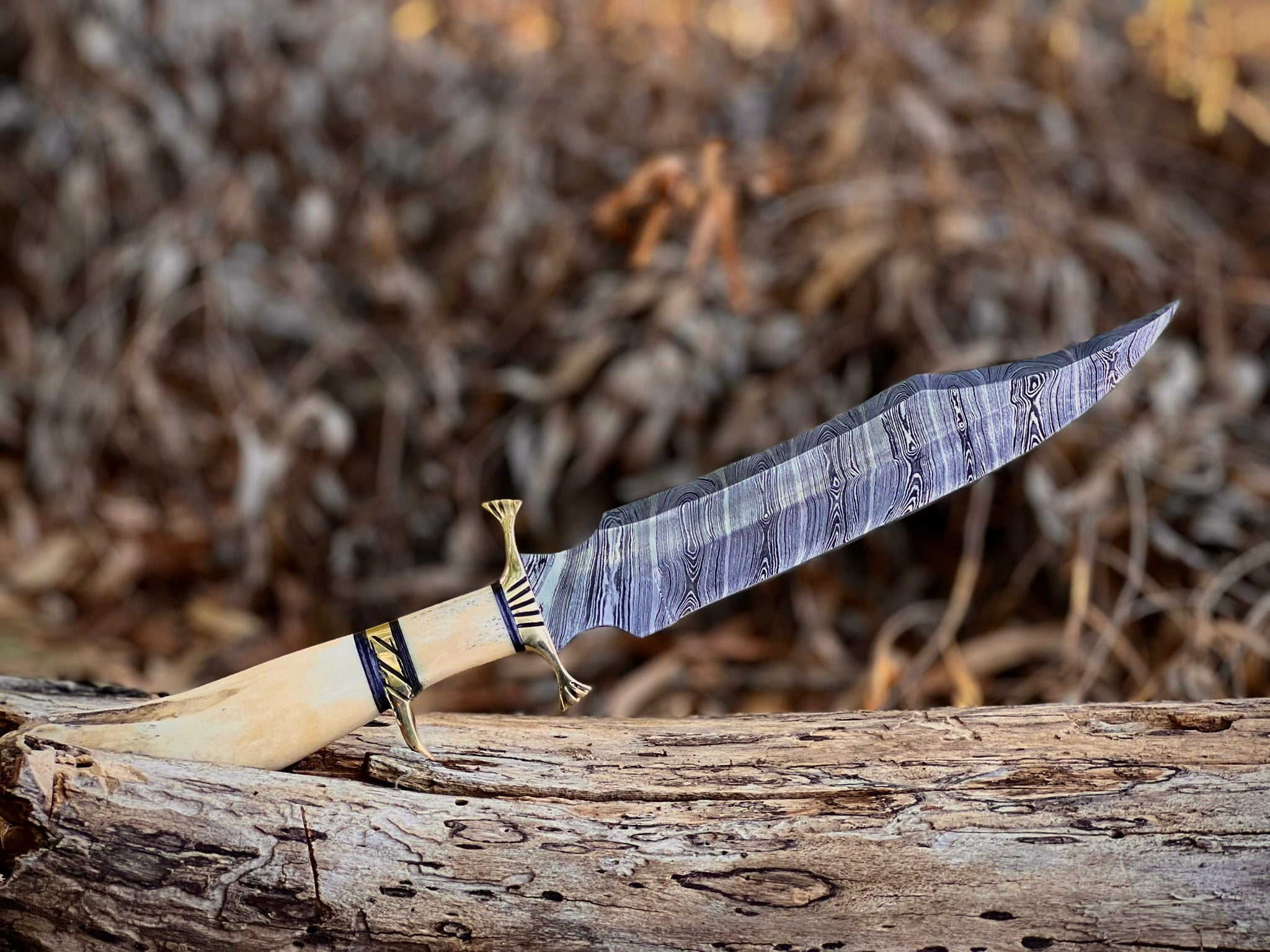 Boneguard Damascus hunting knife with bone handle and brass guard