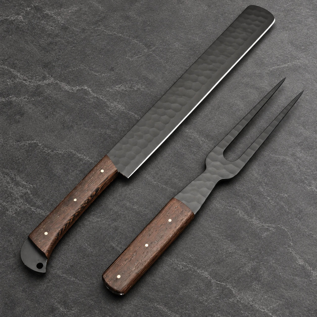 Black brisket slicer and carving fork set shown at an angle, hammered finish and bright edge