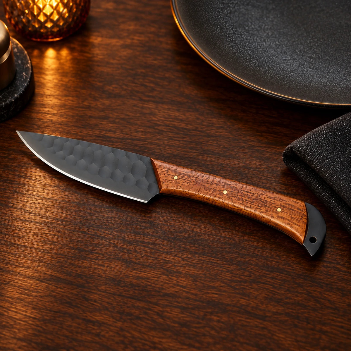 Single black hammered steak knife with straight edge and rosewood handle