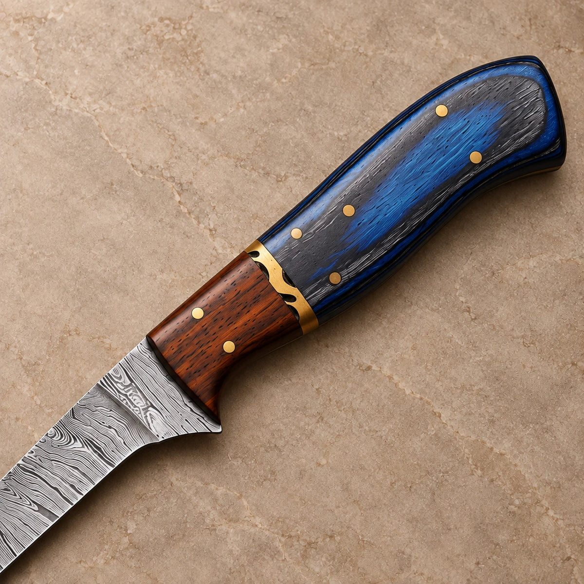 Close-up of blue wood and rosewood handle with file-worked brass spacer and brass pins