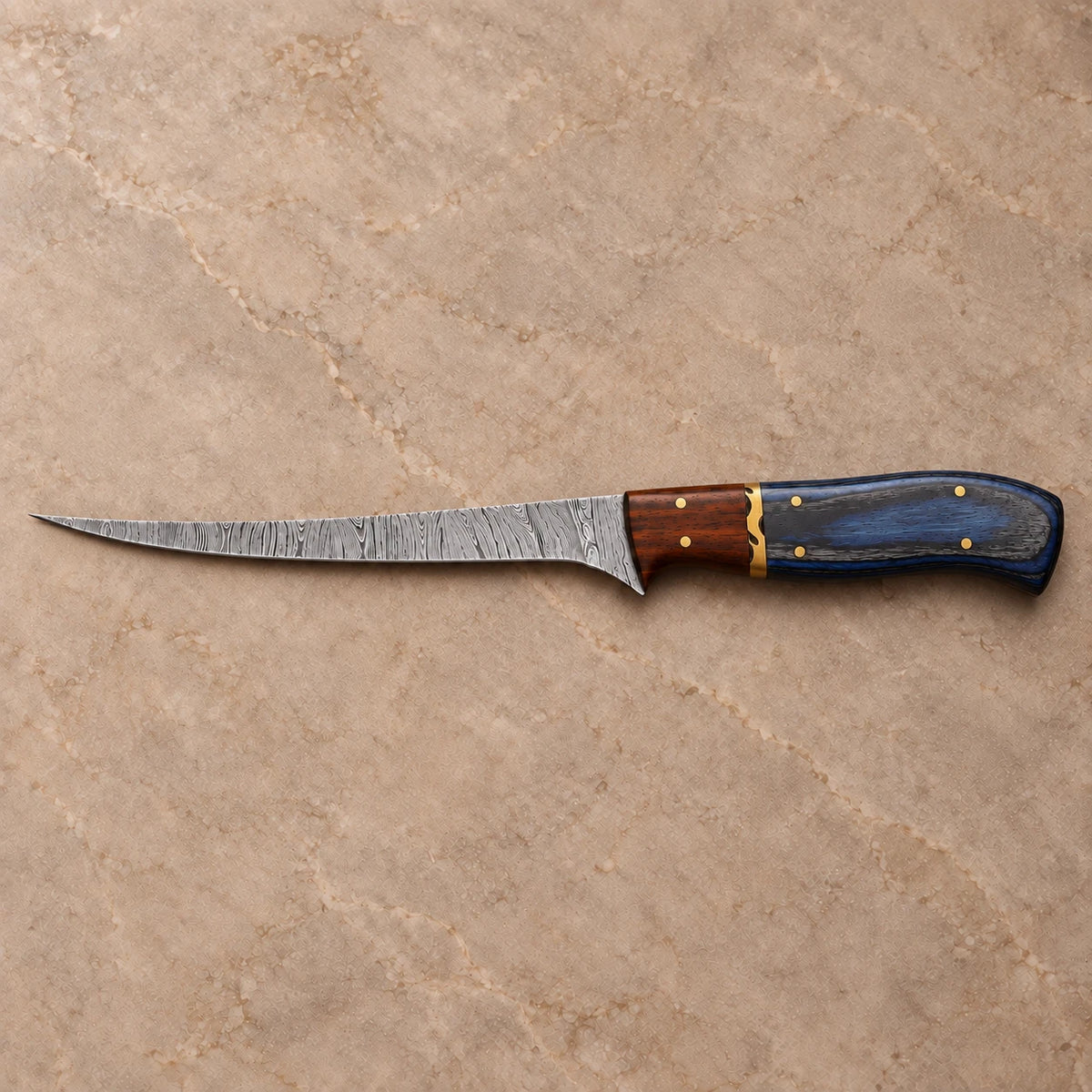 7-inch Damascus fillet knife shown side on with slim upswept blade