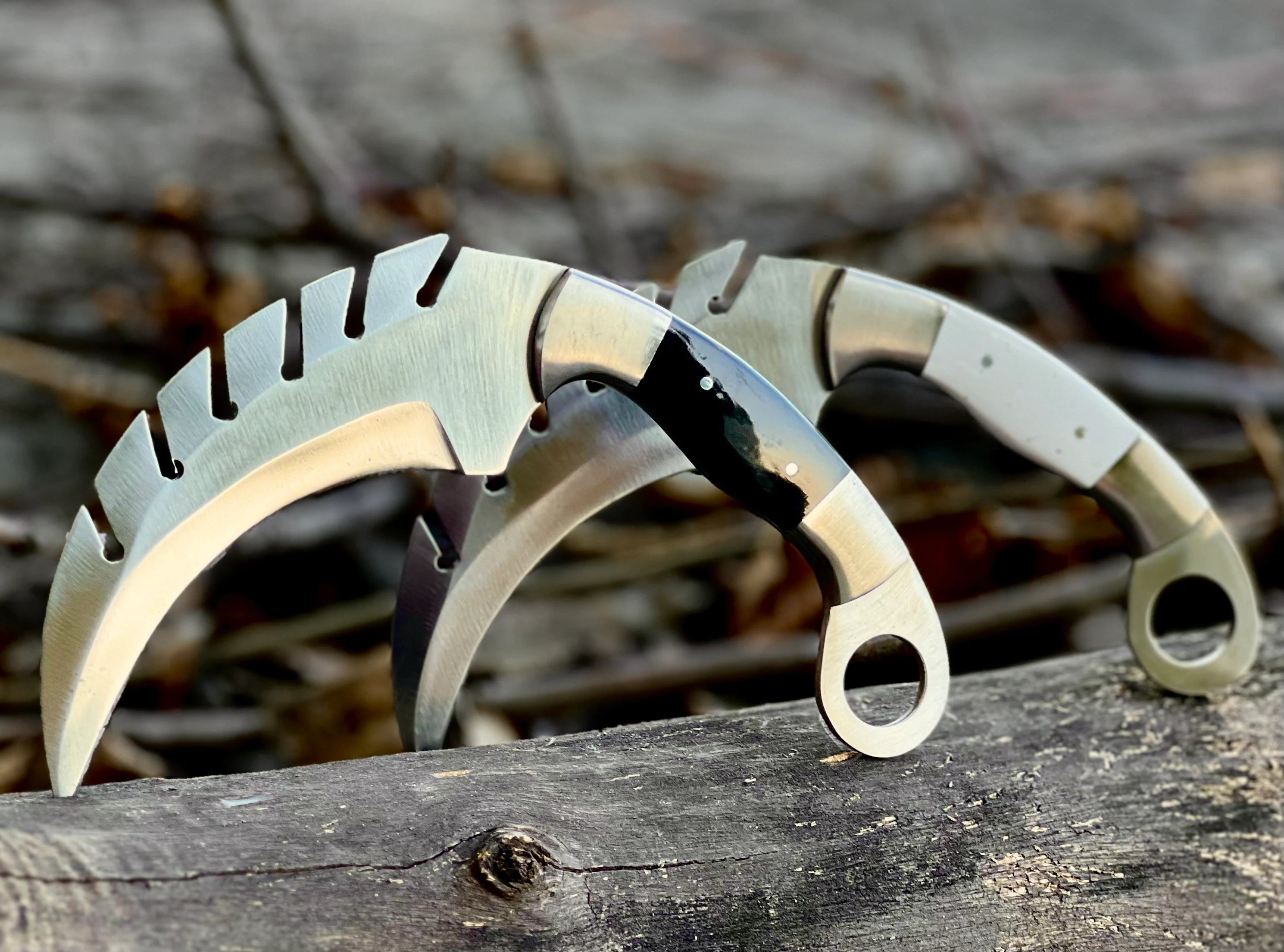 Forged saw-tooth karambit knife with camel bone and buffalo horn handles