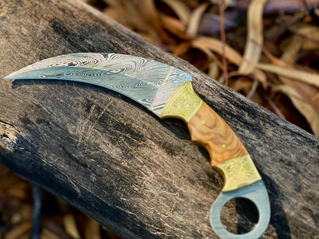 Damascus karambit utility knife with olive wood handle and leather sheath