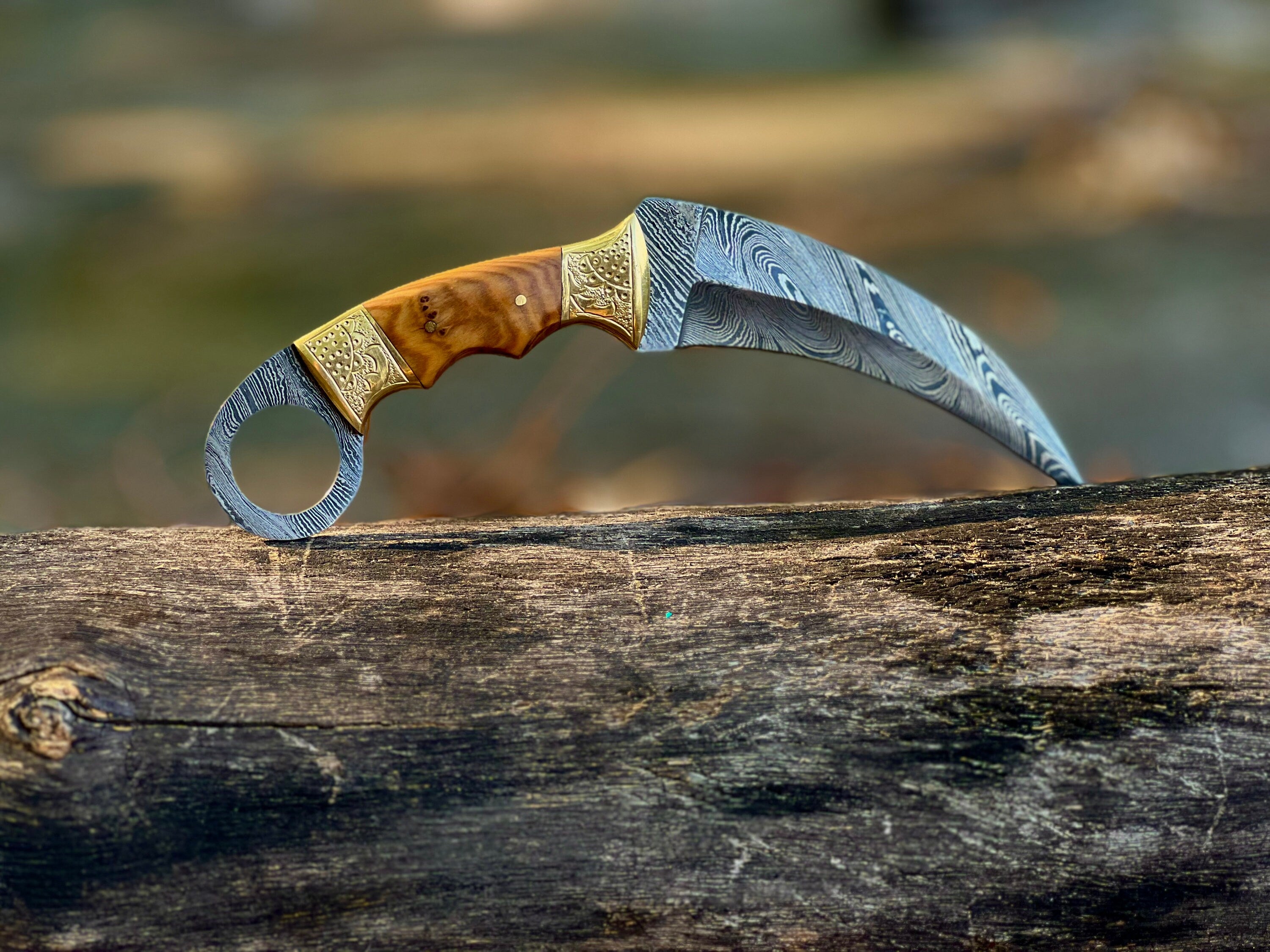 Damascus karambit utility knife with olive wood handle and leather sheath
